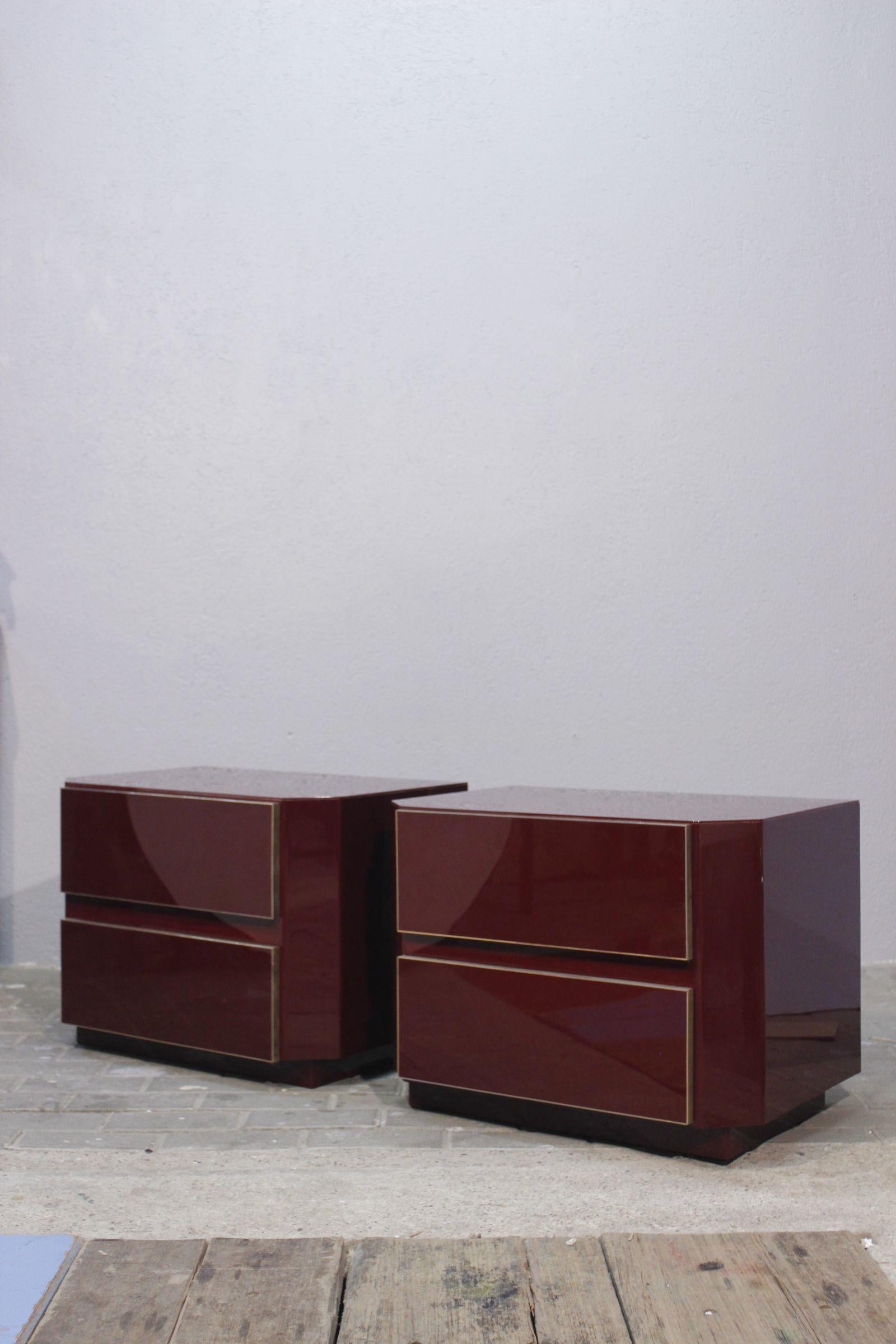 Late 20th Century Pair of Jean Claude Mahey Burgundy lacquer & brass Nightstands, 1970s