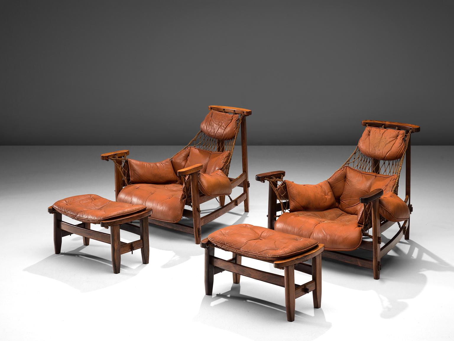 Jean Gillon, 'Jangada' pair of armchairs and ottomans, rosewood, nylon rope, leather, Brazil, 1968.

These robust and hefty armchairs are designed by Jean Gillon. The originality of these Janganda come from the concept of the body being captured