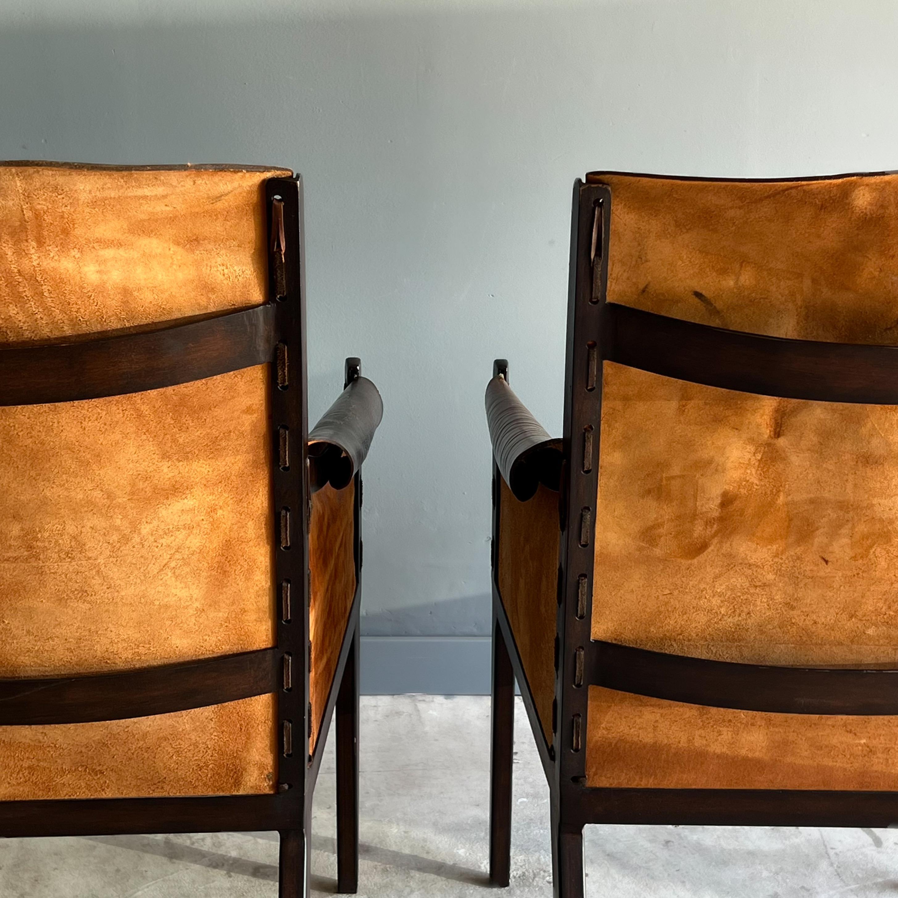 Machine-Made Pair of Jean Michel Frank Style Leather and Metal Arm Chairs