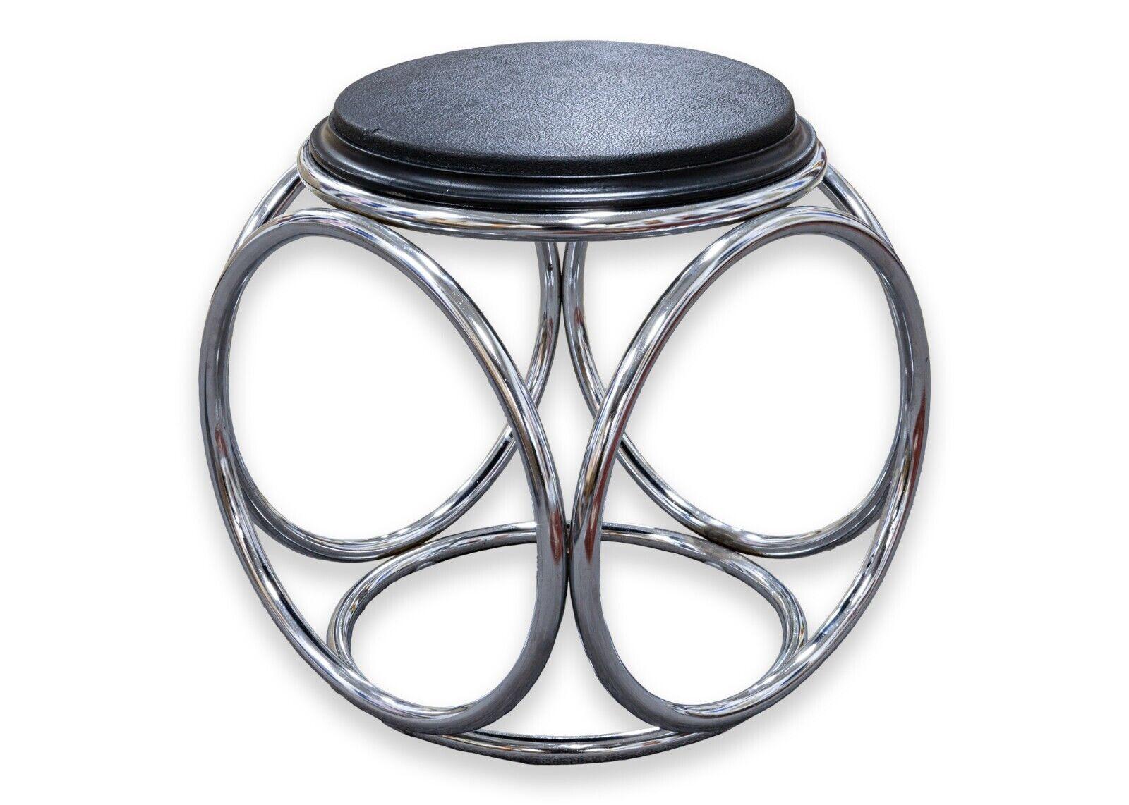 A pair of Jean Pierre Laporte French art deco stool/end side tables. A very unique, chic pair of hybrid pieces. Constructed with a clean, chrome and black plastic, these pieces have a very sophisticated design. The black tops are flippable with one