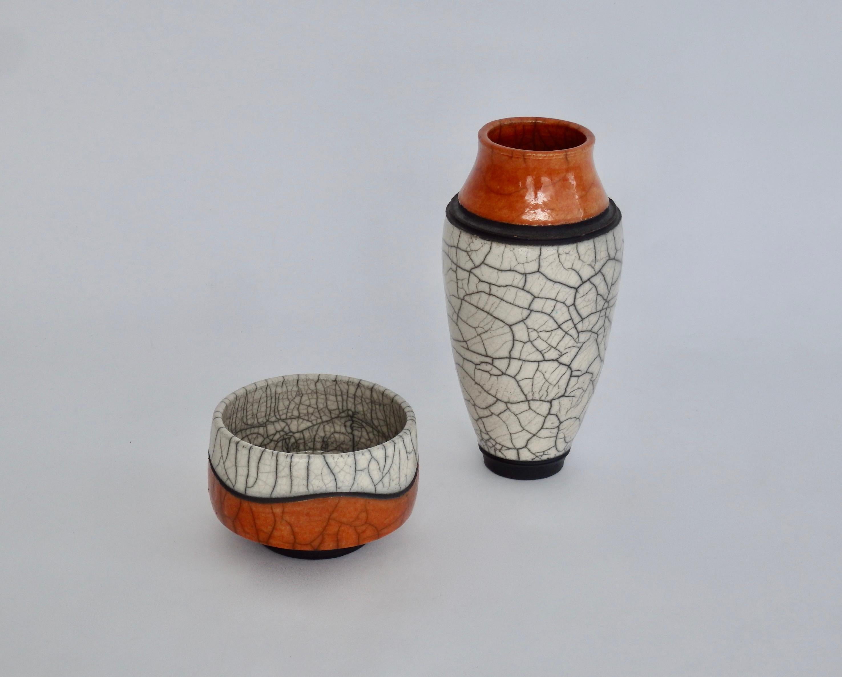 Pair of crackle glaze raku stoneware vessels handmade by Jeff Hale, signed. 
Measures: Vase '06, measures 7.25