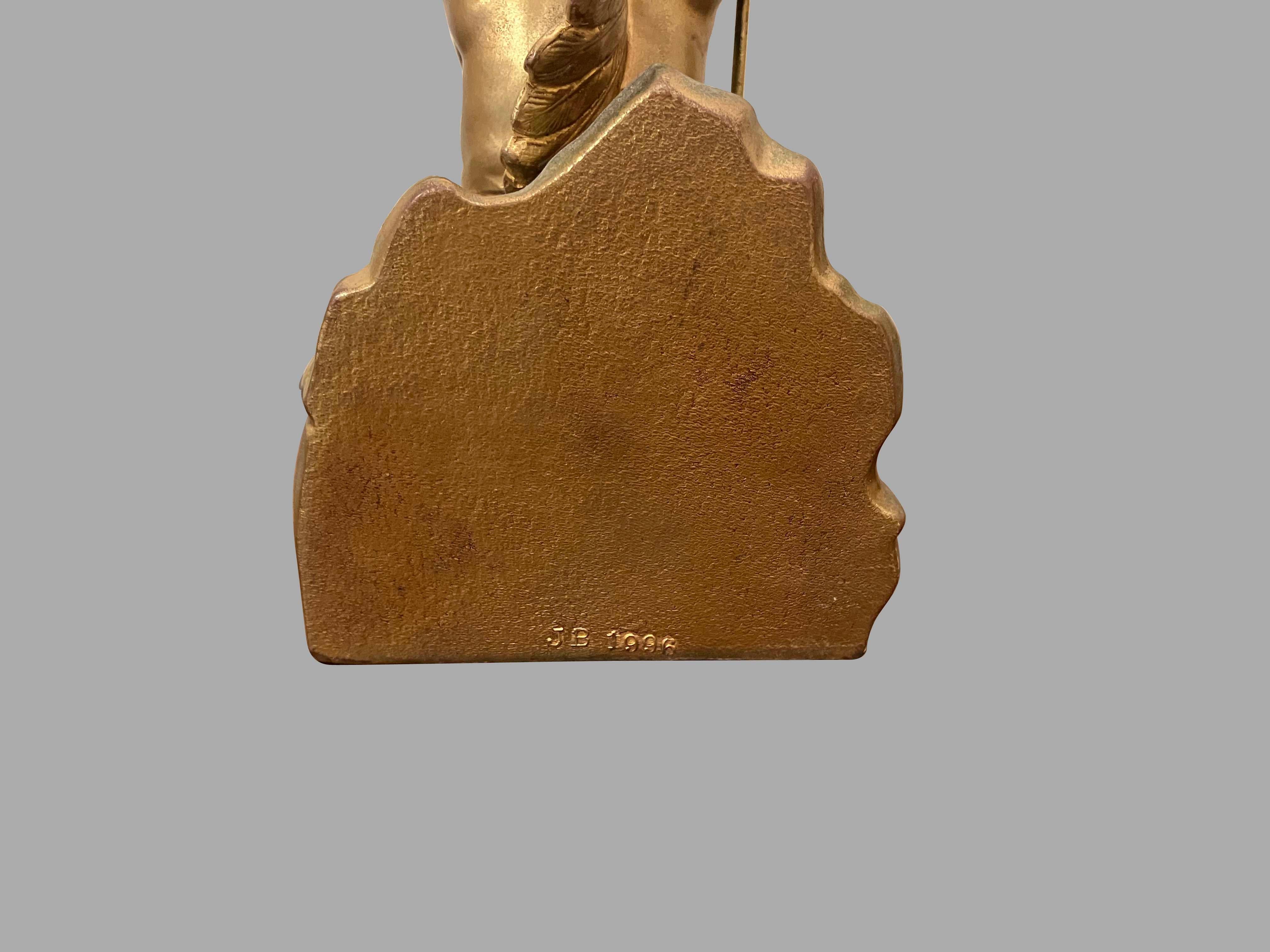 Pair of Jennings Bros. Native American Bookends in Yellow Metal In Good Condition In San Francisco, CA
