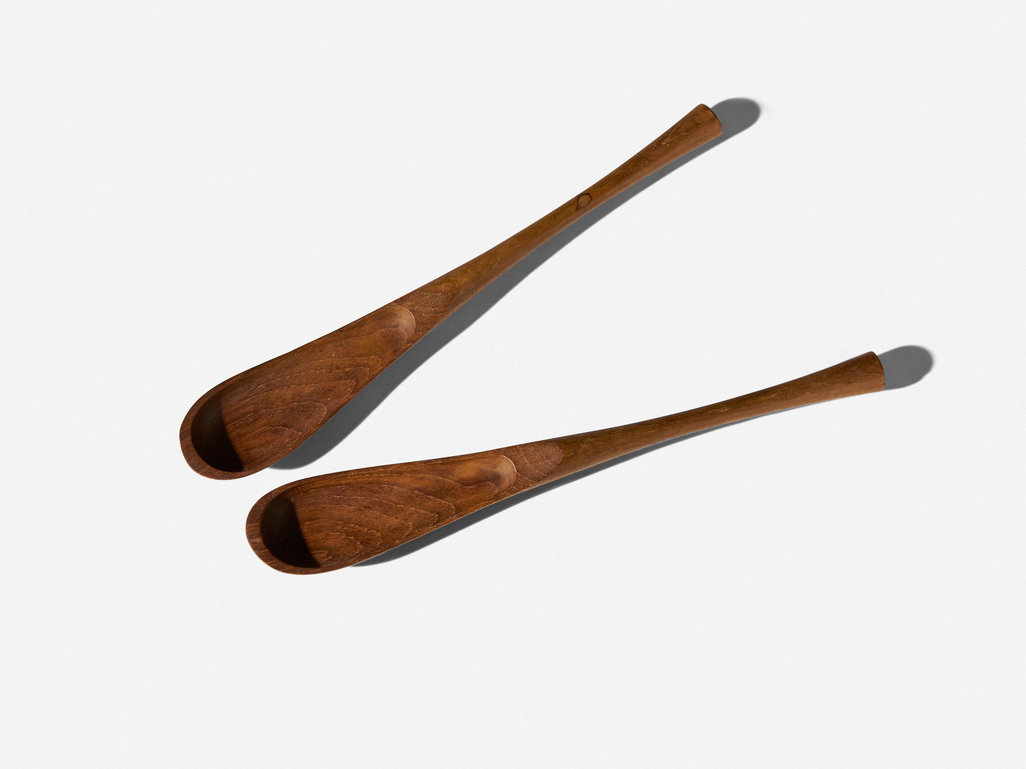 Pair of Jens Quistgaard Danish teak salad servers. 
From a Mid-Century Modern collection. 
Signed 