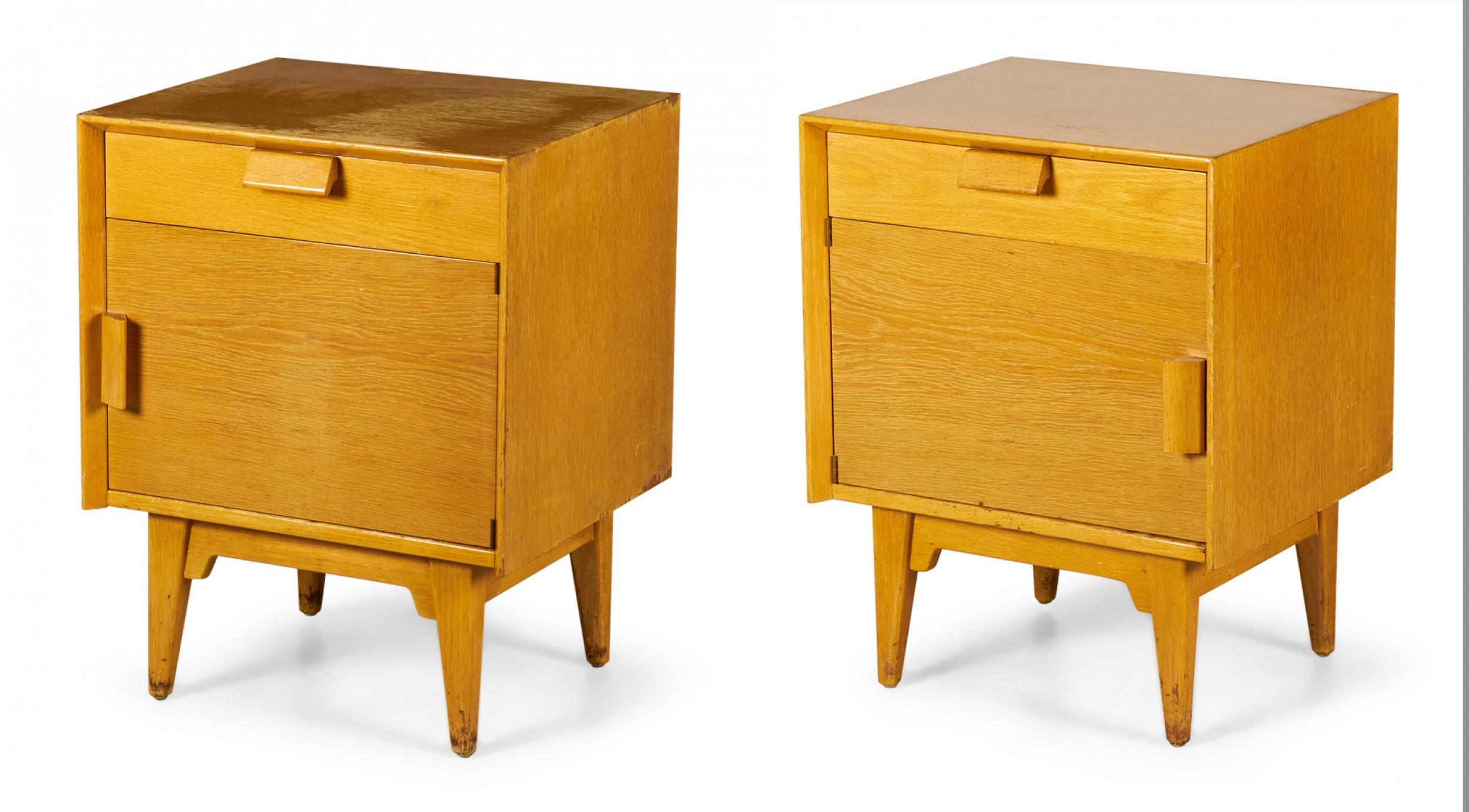 PAIR of Danish Mid-Century blond oak bedside tables / commodes with a single upper drawer above a cabinet compartment with angled wooden drawer pulls resting on four tapered wooden legs. (JENS RISOM)(PRICED AS PAIR)
