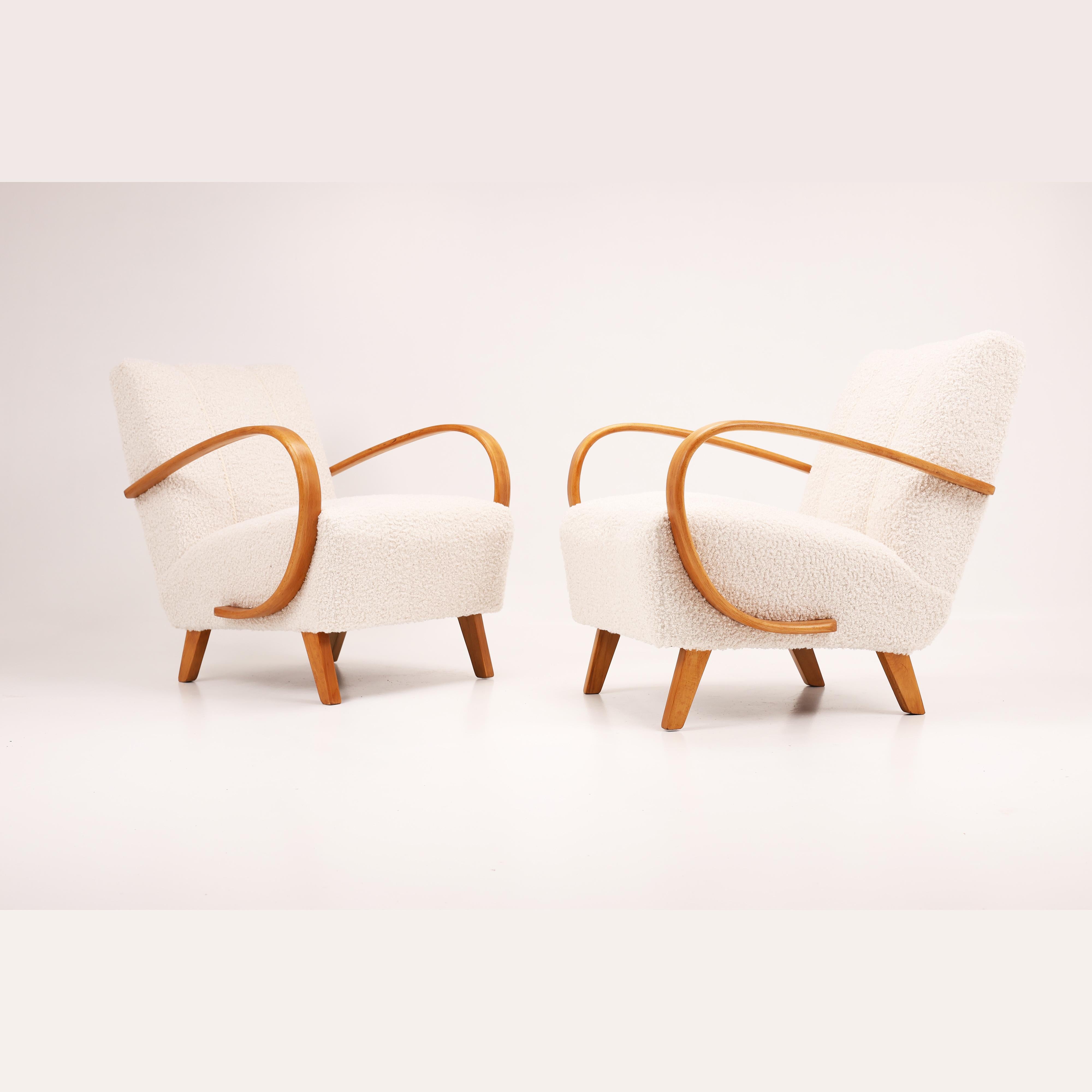 Pair of Jindřich Halabala Armchairs, Model H-410, Czechoslovakia, 1950s

A stunning pair of iconic Model H-410 armchairs designed by Jindřich Halabala, one of the leading figures of Czech modernist design. These sculptural chairs feature Halabala’s