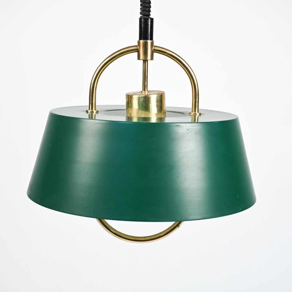With its matte enameled shade and geometric brushed brass halo that doubles as a handle, Jo Hammerborg's 