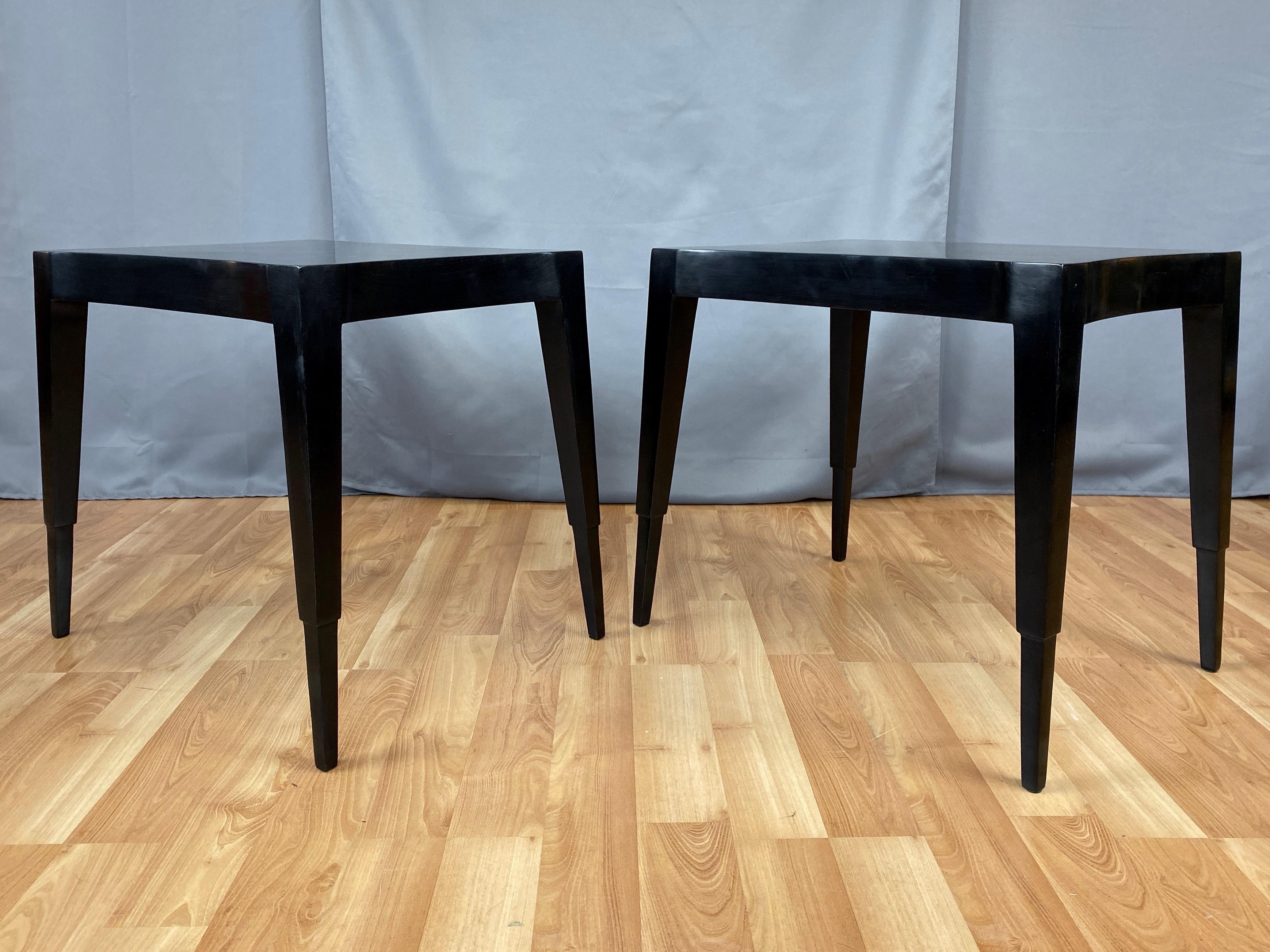 An uncommon pair of sublime mid-1940s Hollywood Regency model 3084 black lacquered mahogany side or end tables by Johan Tapp.

Impeccable proportions, lithe lines, and canted stance combine to exhibit an understated yet eye-catchingly confident