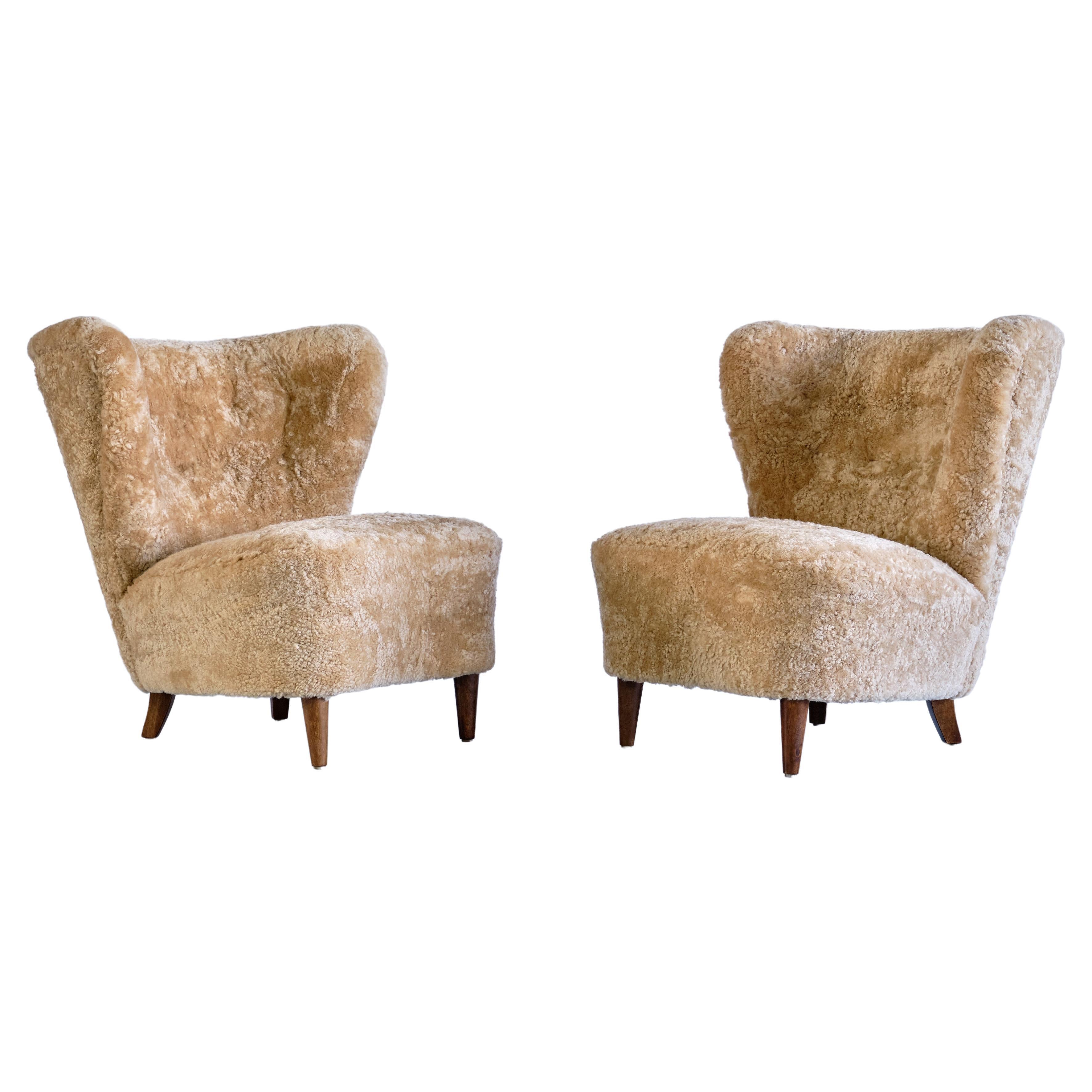 Pair of Johannes Brynte Lounge Chairs in Sheepskin and Ash Wood, Sweden, 1940s For Sale