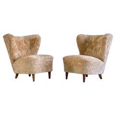 Pair of Johannes Brynte Lounge Chairs in Sheepskin and Ash Wood, Sweden, 1940s