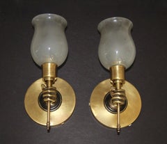 Pair of John Devoluy Style Hand Torch Bronze Wall Sconces