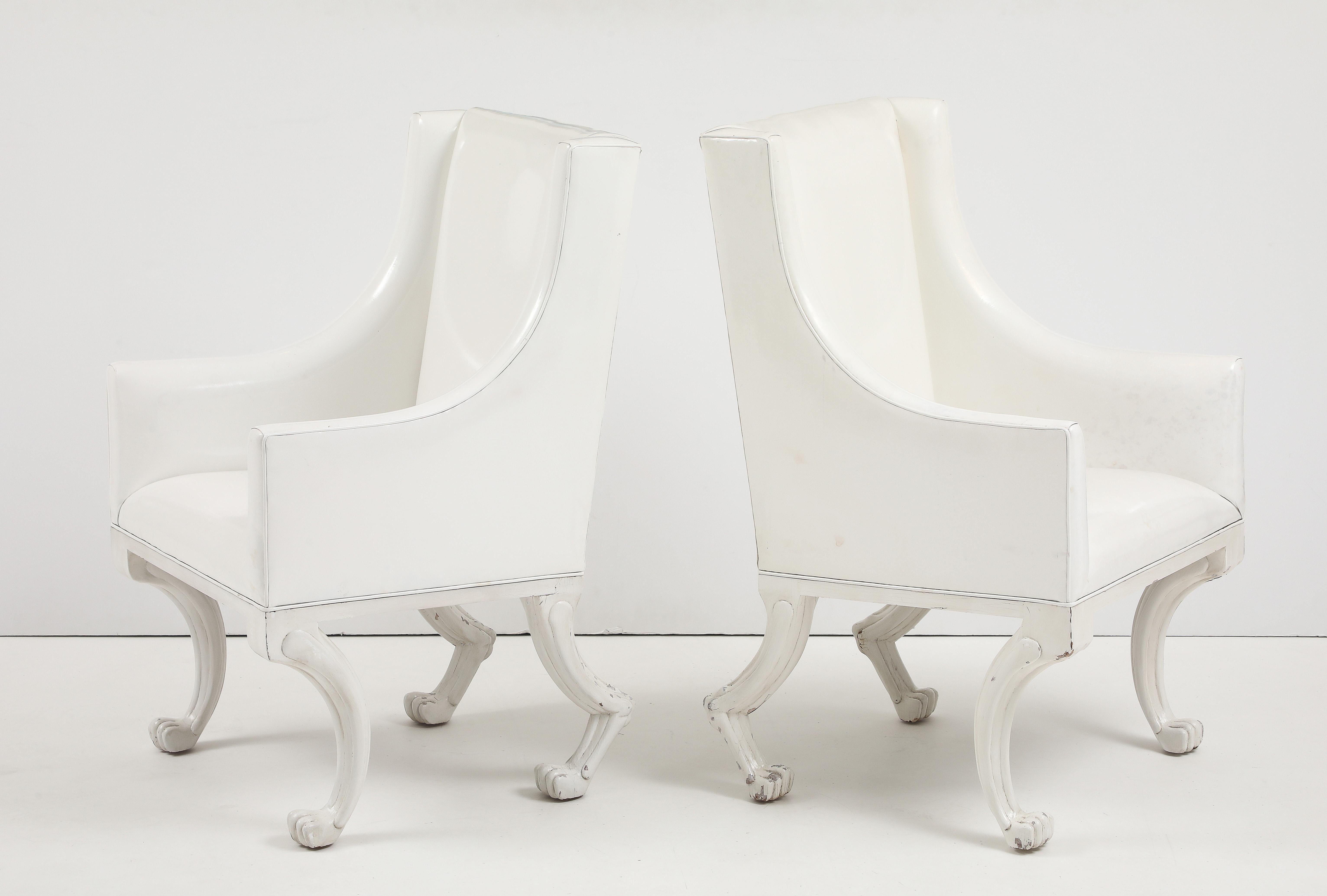 Pair of Etruscan club chairs covered in a white patent leather with wooden legs and an Ivory craquelure finish.
Each chairs has age related wear which only enhances the beauty of them.
The chairs are price by the pair  and there are 2 Pairs available