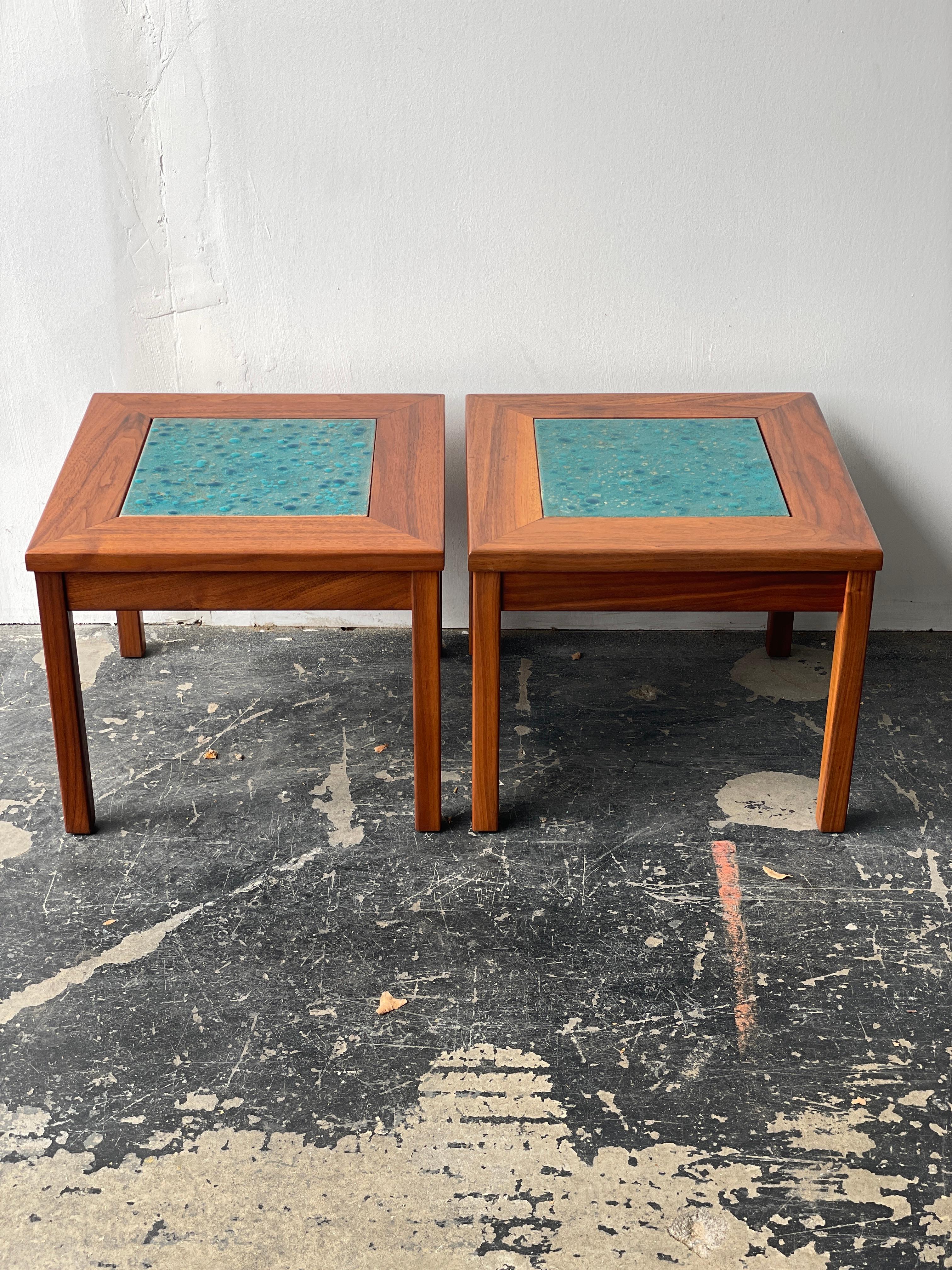 Pair of solid walnut and enamel copper tile tables titled ‘Constellation’ produced by high-end Californian furniture manufacturer, Brown Saltman for Designer John Keal. These unique copper enamel tile inlay are in excellent vintage condition. Tables