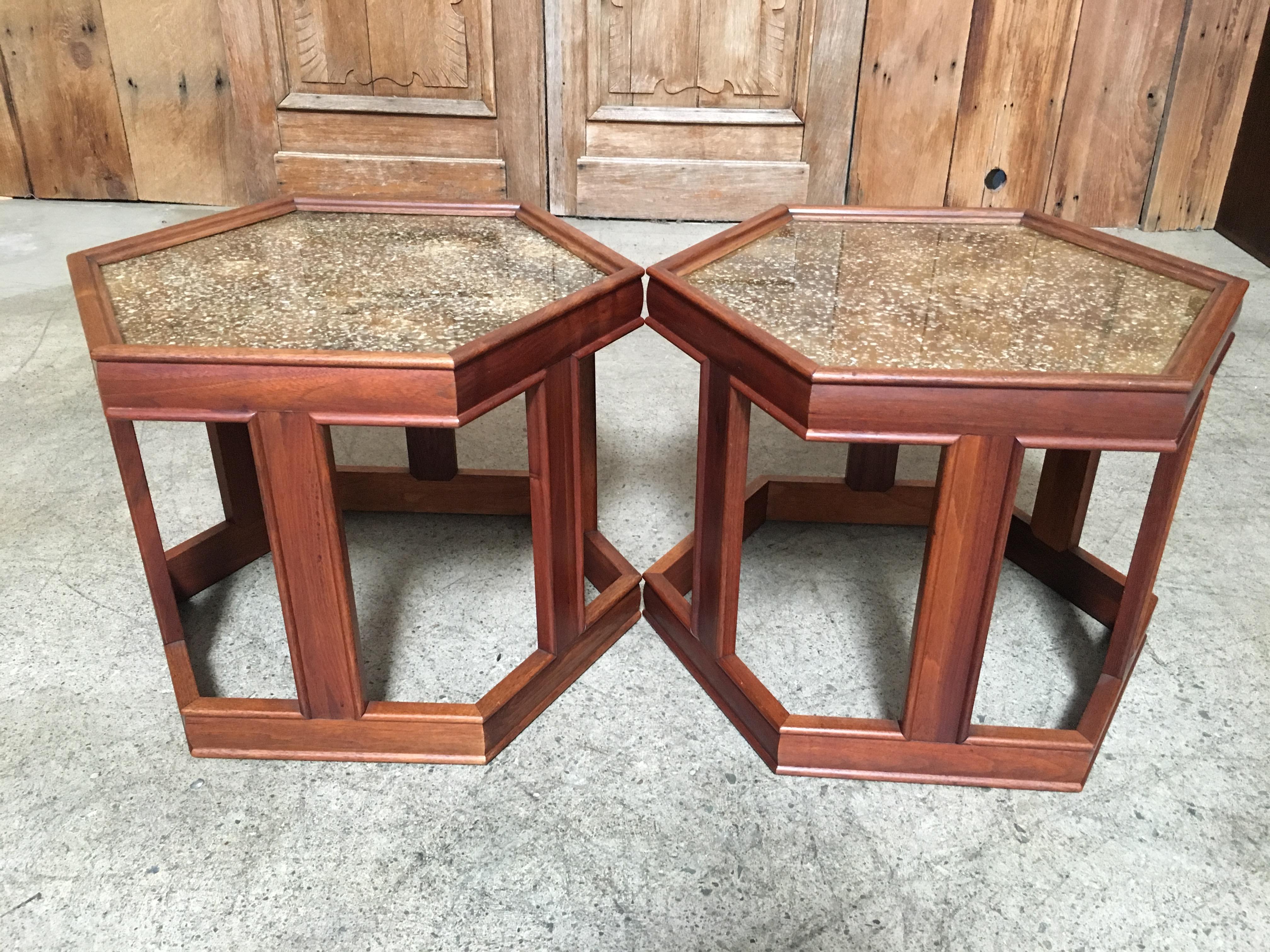 Pair of octagonal side tables, Frames is walnut with enamel textured design under glass tops.