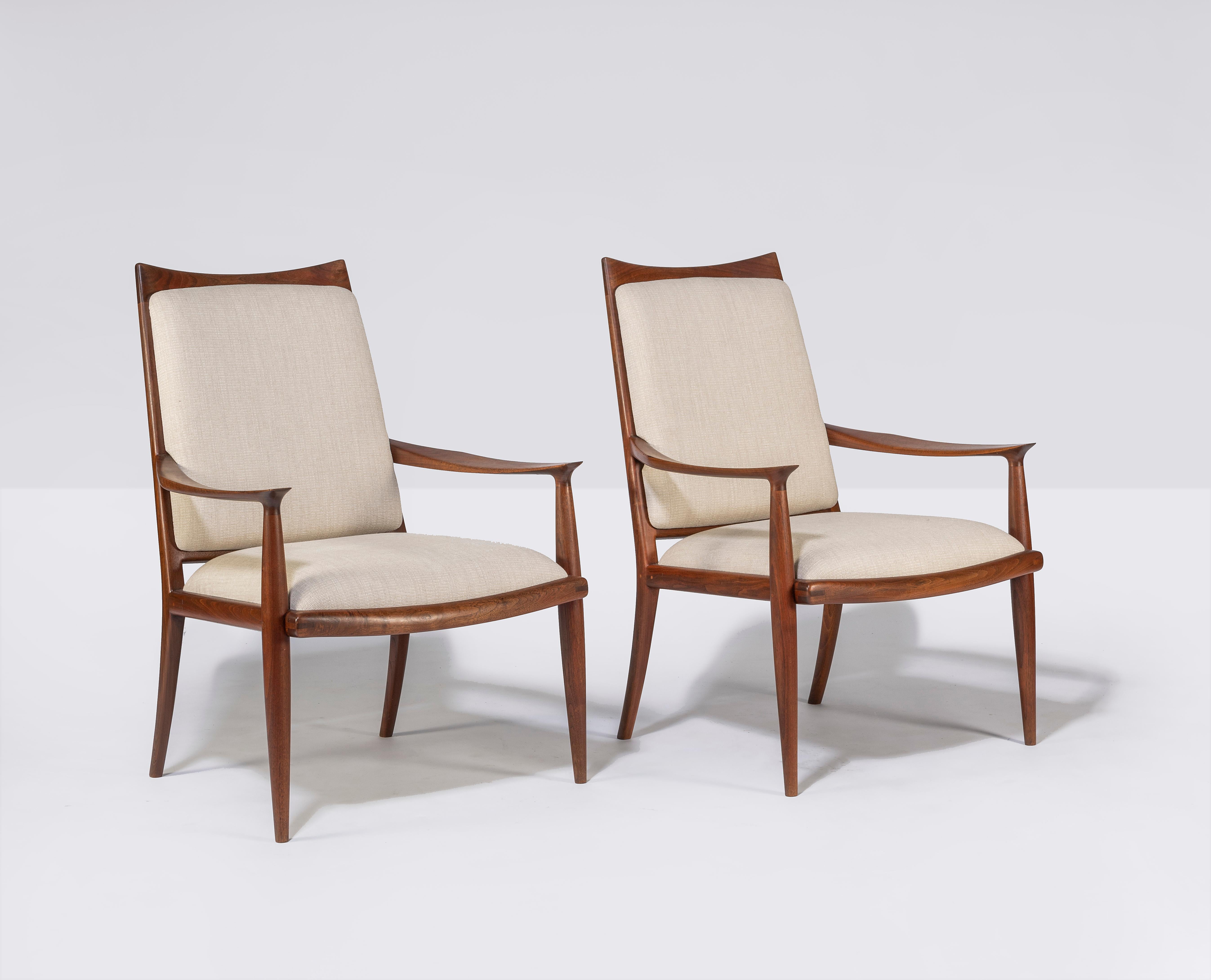 Pair of walnut armed lounge chairs by well-noted California craftsman John Nyquist. 

Well made and finely detailed. 

Newly upholstered.

  