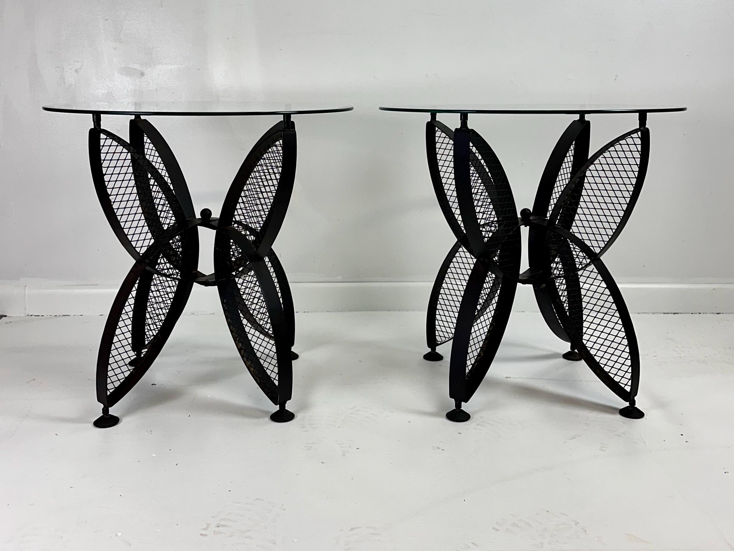 These Mid Century John Salterini Iron side tables are a perfect addition to any home. Iron and glass, these tables are not only durable but also stylish and timeless. With its butterfly design, these tables offer a unique and elegant touch to any