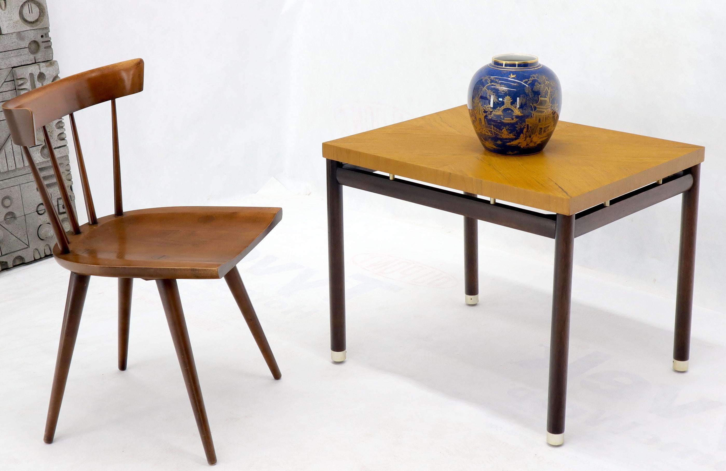 Pair of Mid-Century Modern ebonized brass tips bases side end tables with floating tops.