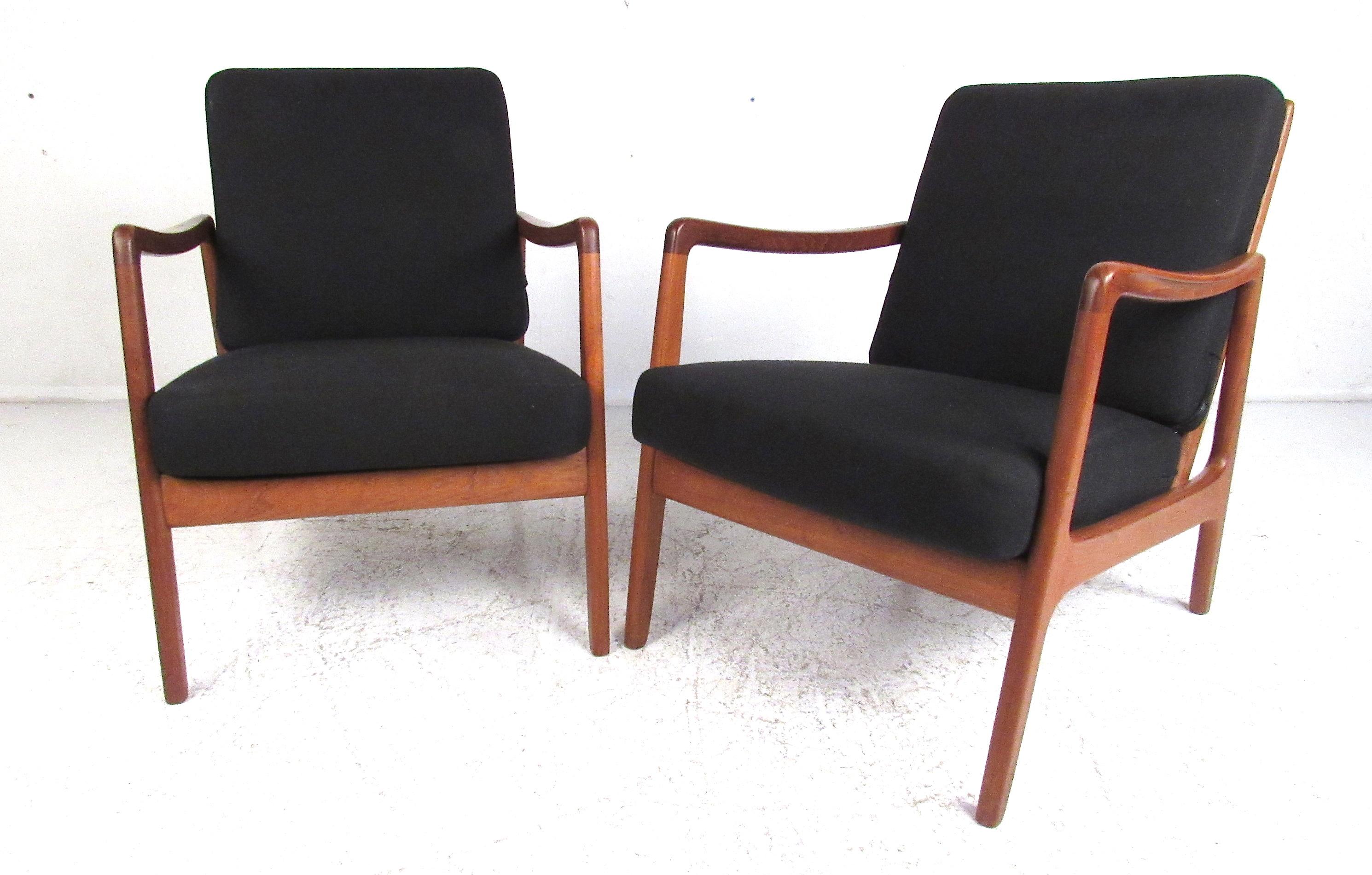 John Stuart midcentury model 109 chair designed by Ole Wanscher for France & Sons. In solid teak. 
with original cushions reupholstered and label intact. Please confirm item location (NY or NJ) with dealer.