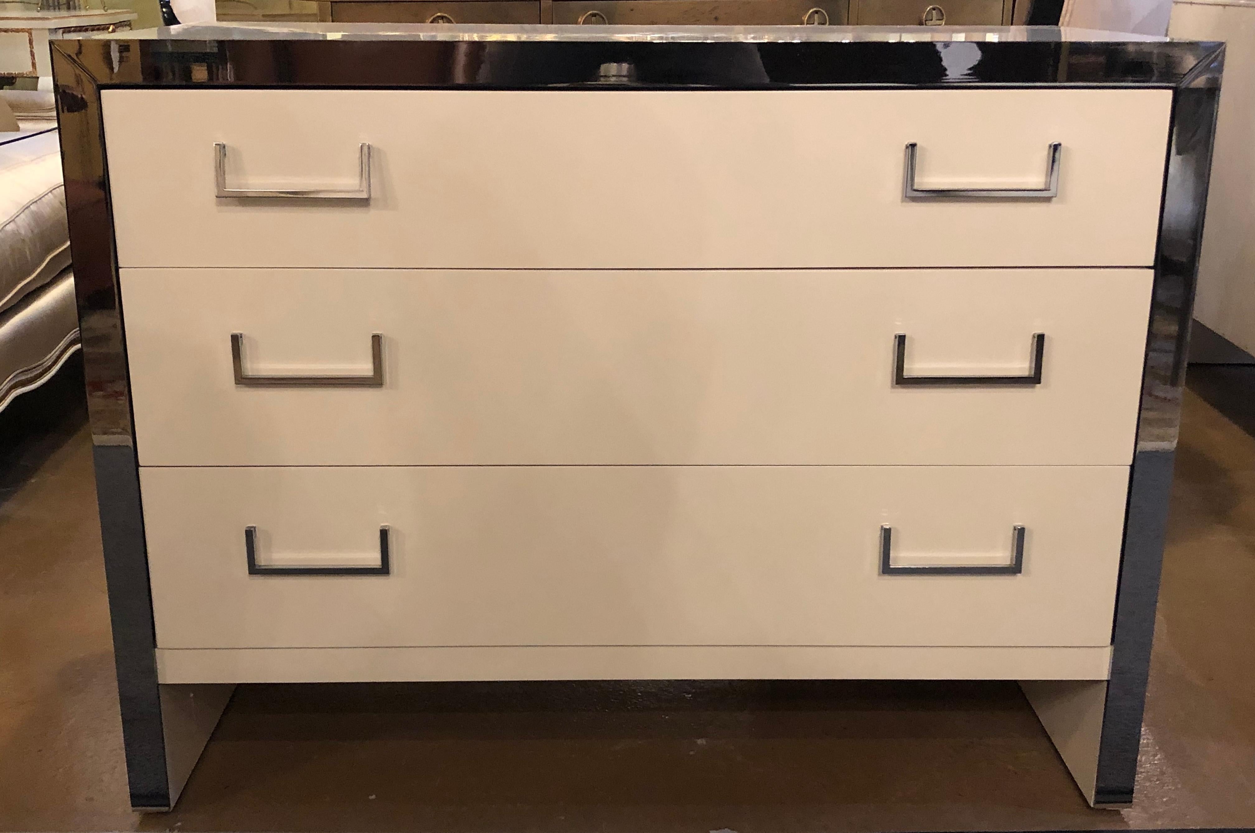 Pair of spectacular Mid-Century Modern recently refinished John Stuart labeled white lacquer and chrome accented chests, commodes, dressers or nightstands. These stunning Milo Baughman Designed pair of chests by the Highly Sort After Designer, John