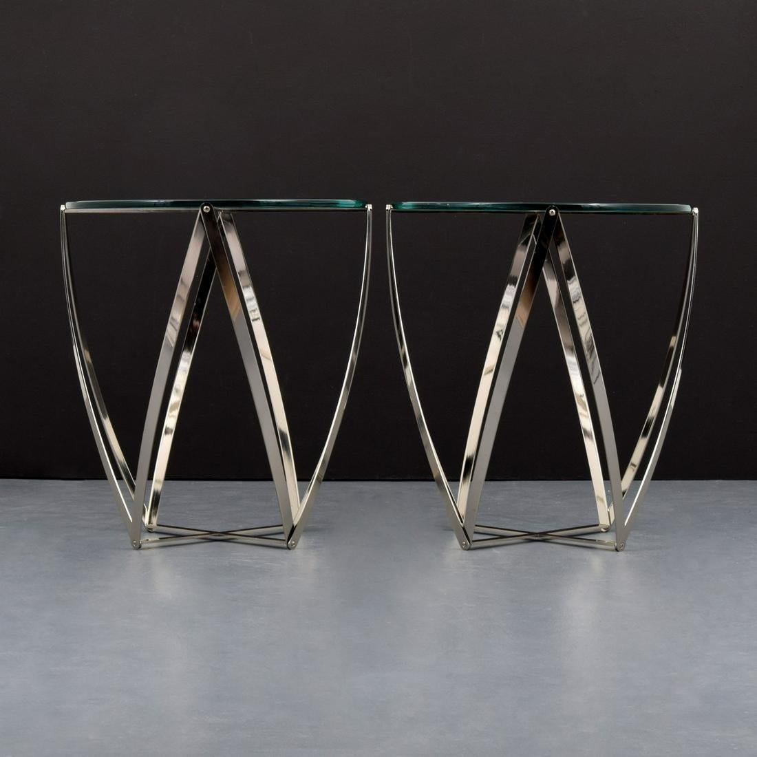 A pair of side or occasional table designed by John Vesey (1924-1992) in 1956.
Made from polished chromed steel strips with subtle zigzag pattern, these tables assume a traditional barrel form while maintaining a very modern appearance. They are