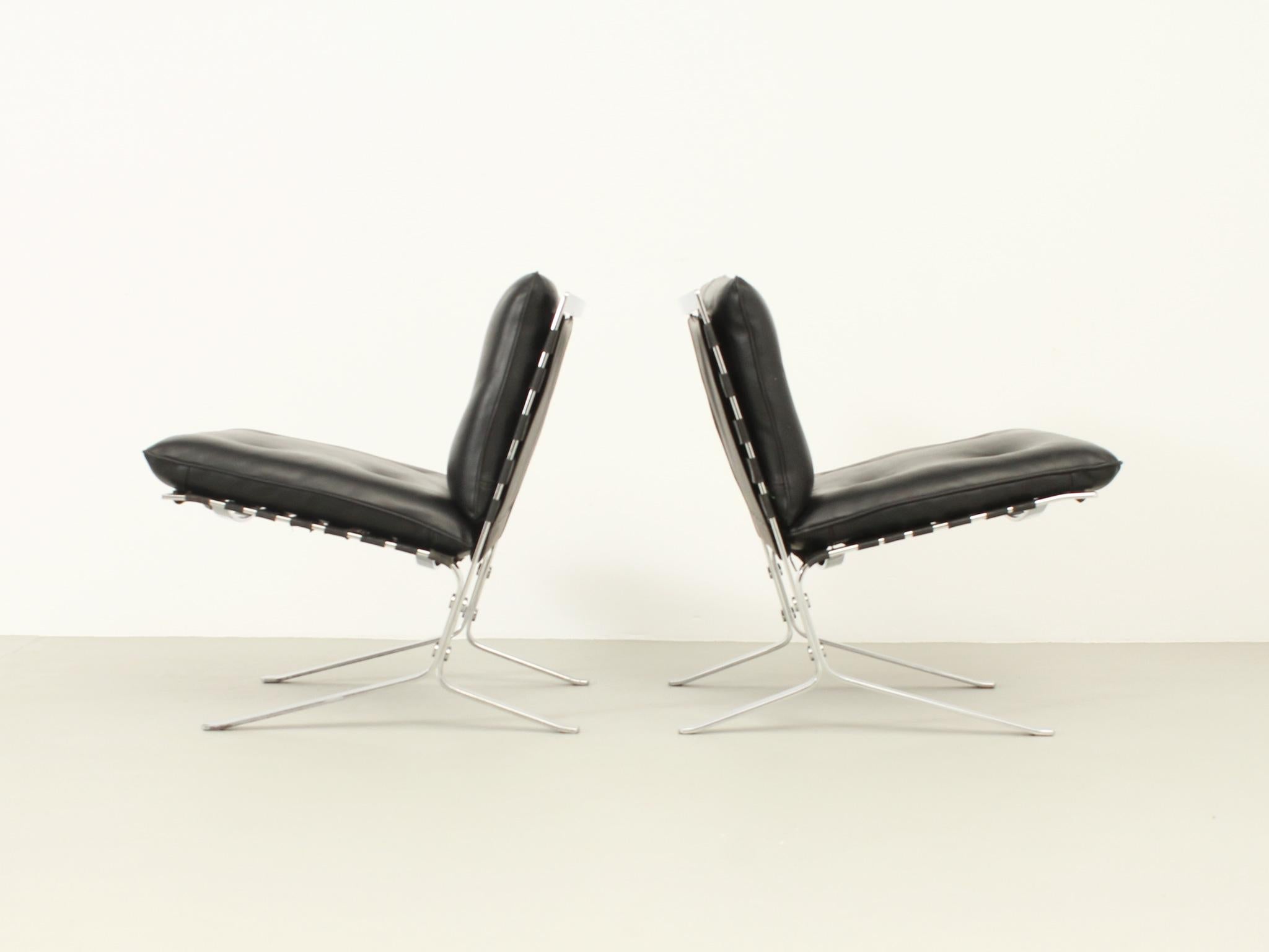 Pair of Joker easy chairs designed by Olivier Mourgue in 1960 for Airborne, France. Chrome steel structure with rubber straps and original vinyl upholstery.