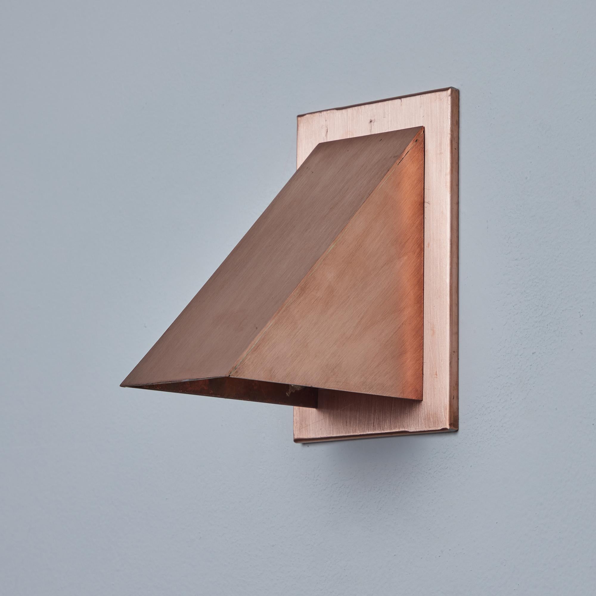 Pair of Jonas Bohlin 'Oxid' Raw Copper Outdoor Wall Lights for Örsjö. Executed in raw unlacquered copper with an opaline glass diffuser. An incredibly refined and clean geometric design that is quintessentially Scandinavian. For indoor or outdoor
