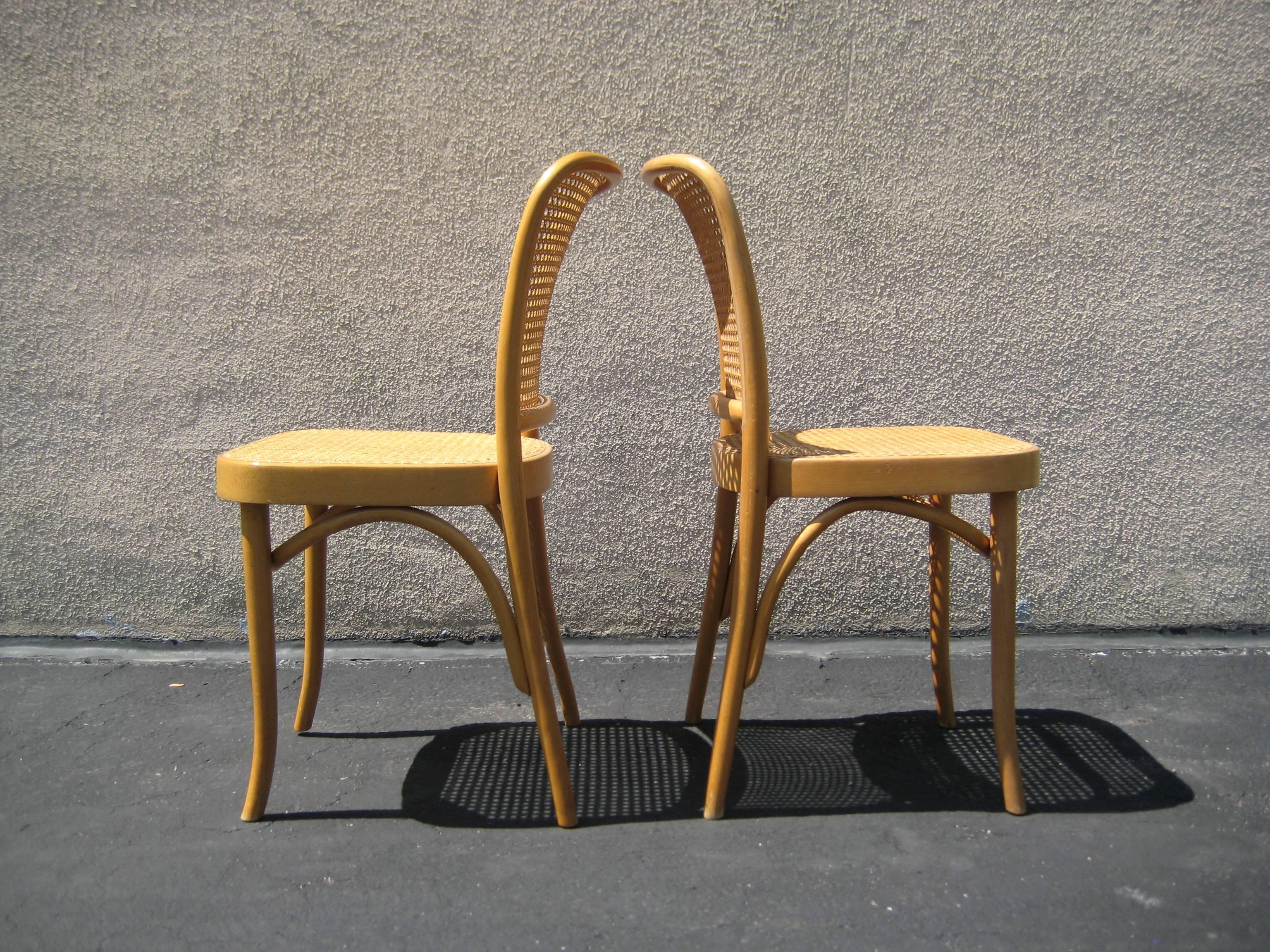 Antique pair of Josef Hoffmann cane bentwood side chairs. Made in Poland. Designed by Josef Hoffmann in 1920s.