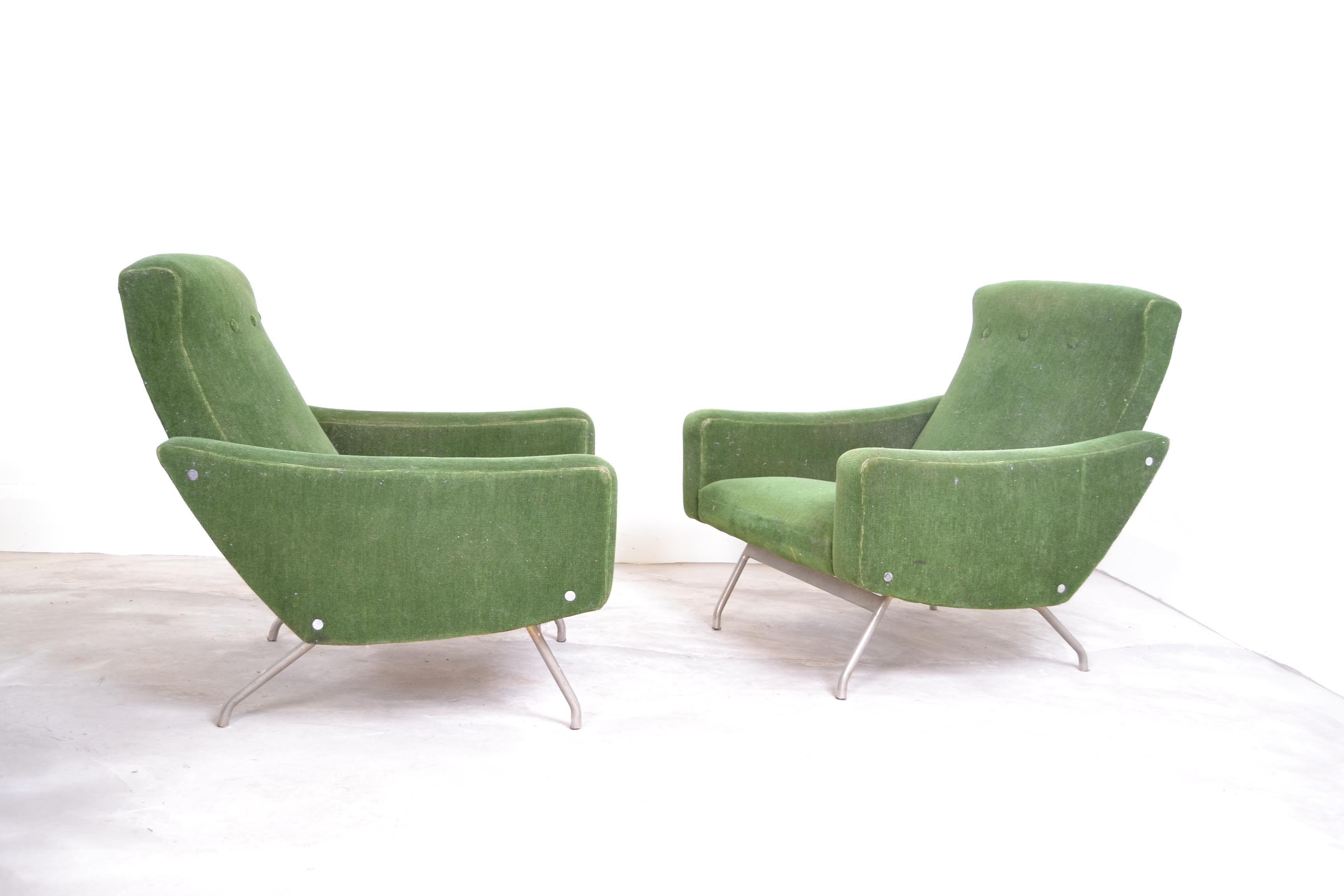 Pair of Joseph Andre Motte armchairs manufactured by Steiner.
These chairs are the steel leg version and have the original Steiner label underneath.
These are a very comfortable large scale pair of armchairs and have been left in
original