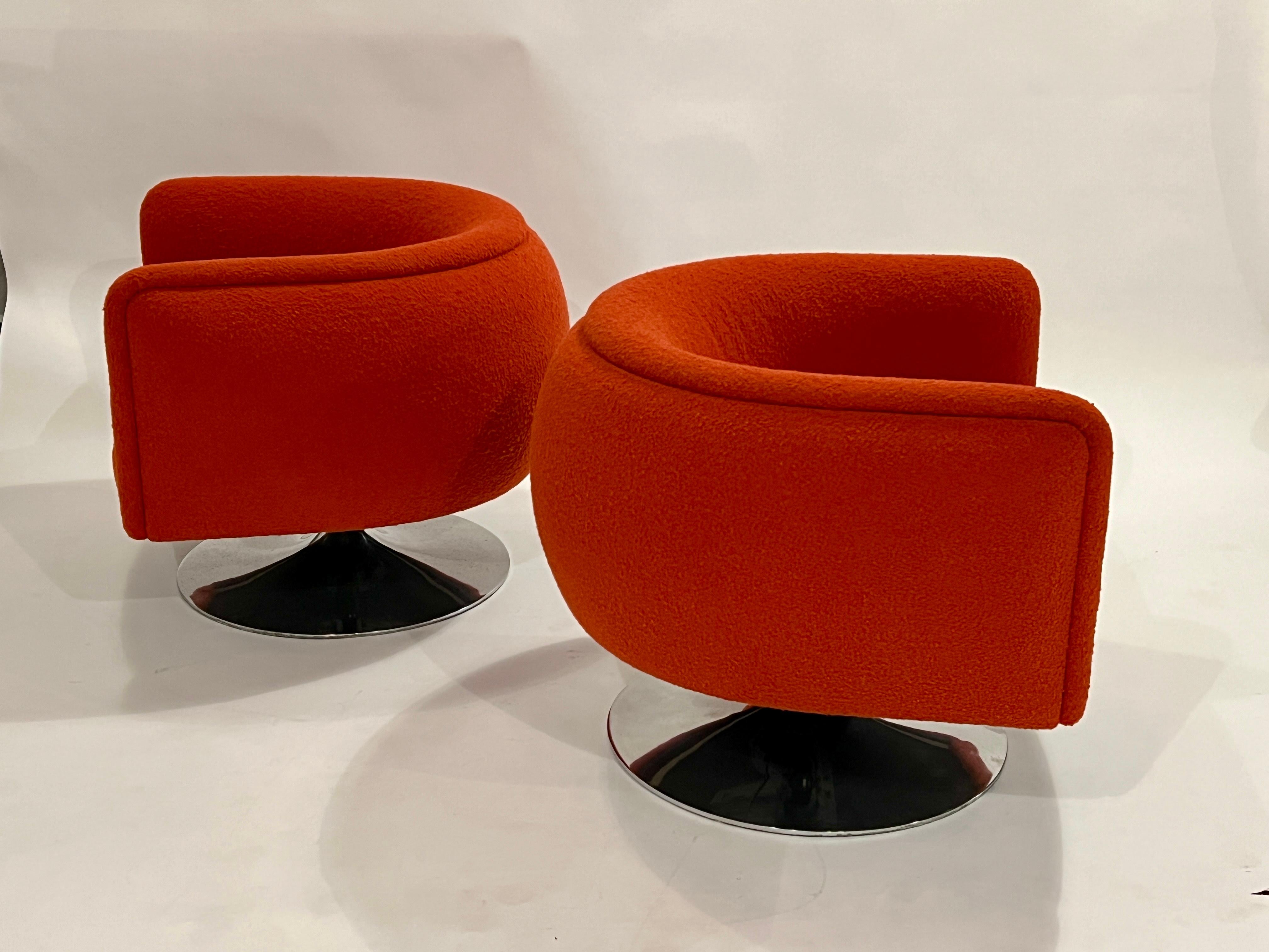 Pair of Joseph D'Urso swivel lounge chairs on polished aluminum chrome bases in all original red boucle fabric and adjustable seats. Measurements with adjustable seat height variations:

Chair: 32