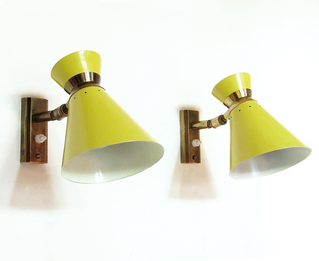 A pair of French 1960s wall lights in joyful lemon yellow by French designer Rene Mathieu.

The lamps can be adjusted to many positions and would suit perfectly for bedside or sofa reading.

In excellent, rewired condition, there is minor patina