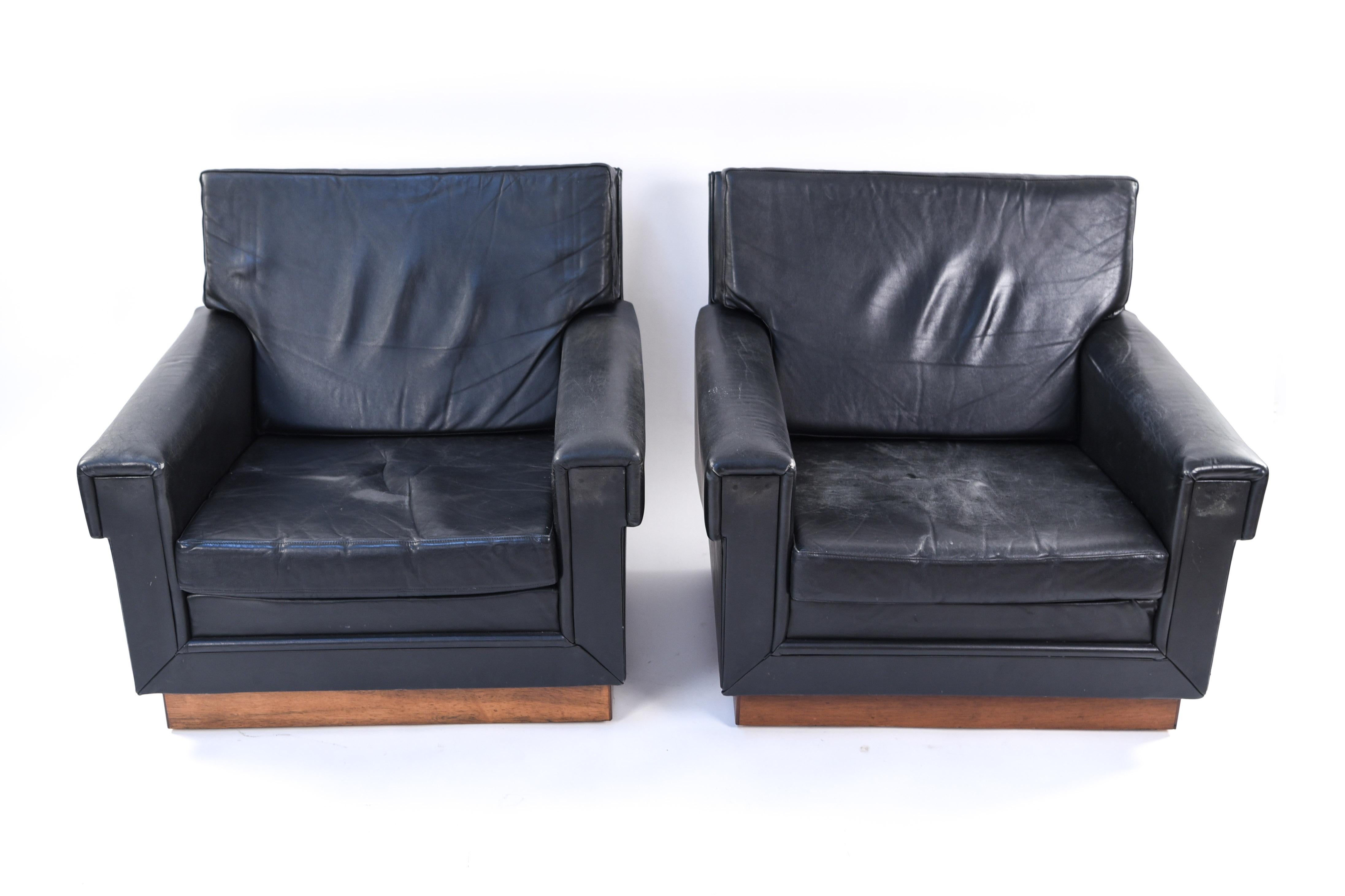 This pair of leather lounge chairs by Jørgen Ryesberg provide ultimate comfort and style. Their box-like, geometric form is a Classic, modern design.