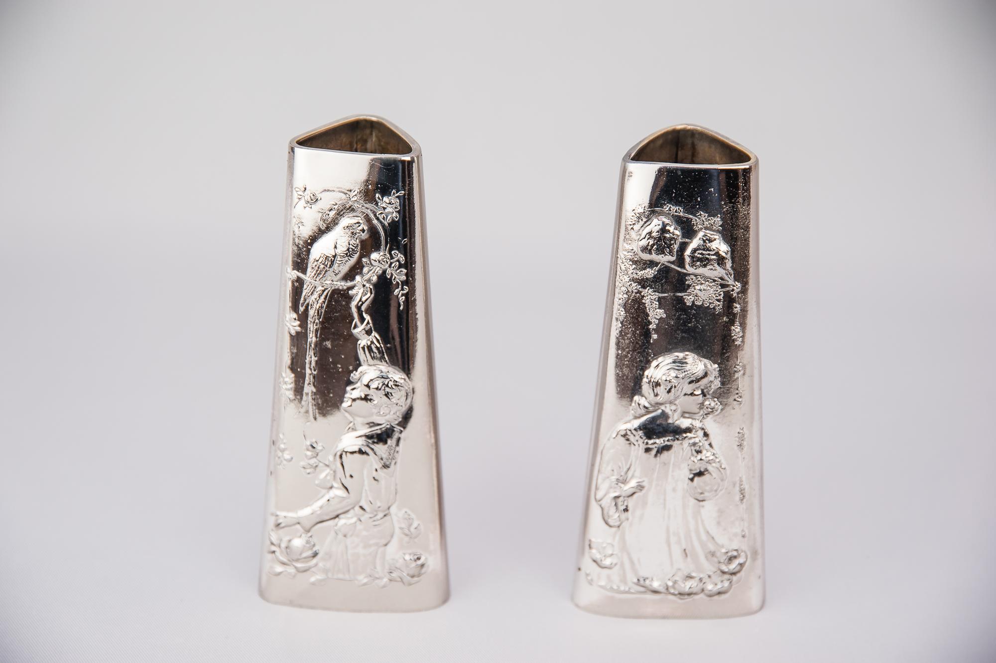 A pair of Jugendstil Alpaca vases, circa 1908s
Polished and stove enameled

Beautiful children with bird's Motivs on both vases.