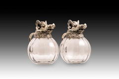 Pair of jugs, wild boars. Silver-plated metal, glass. Possibly Spain, 20th c.