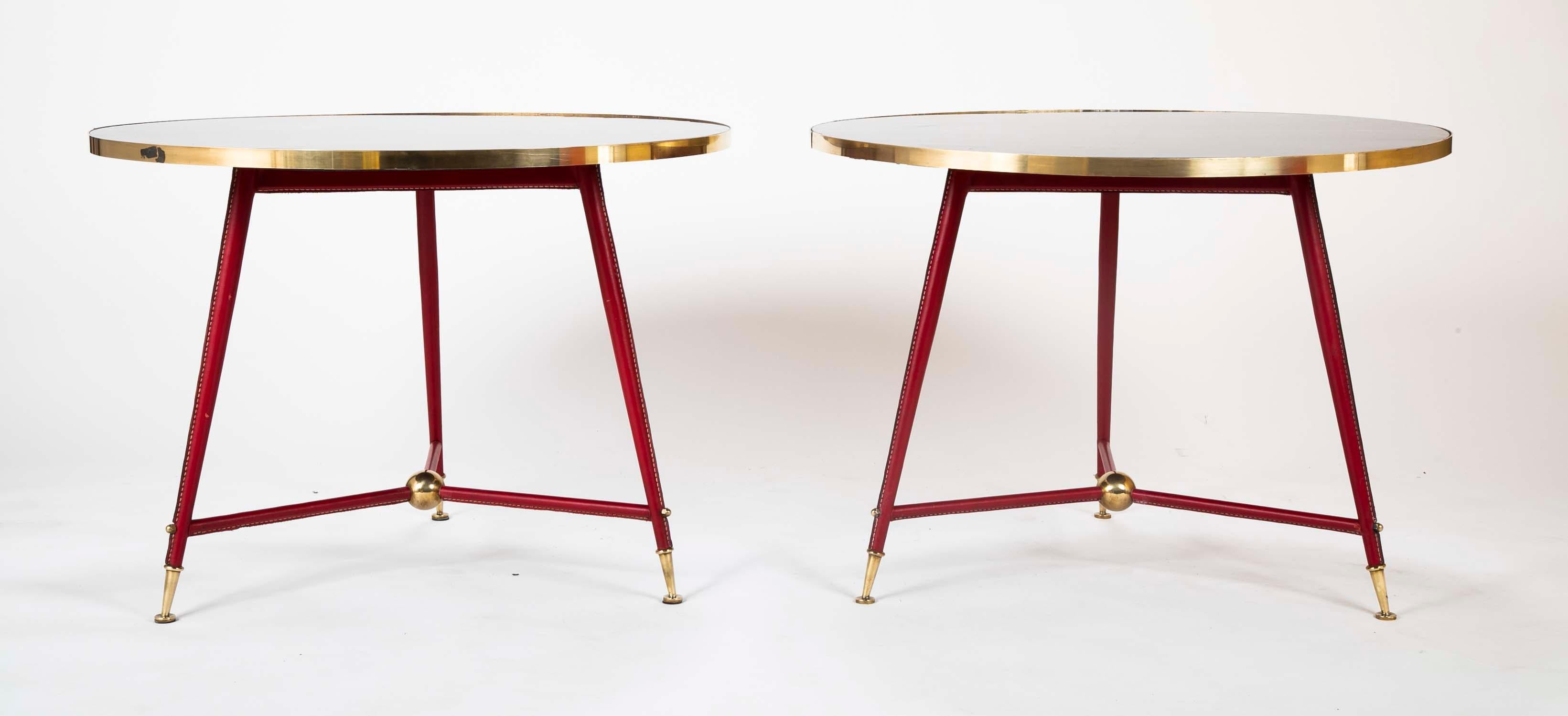 A beautiful pair of Jules Leleu side tables with black lacquered tops. Produced in 1955.