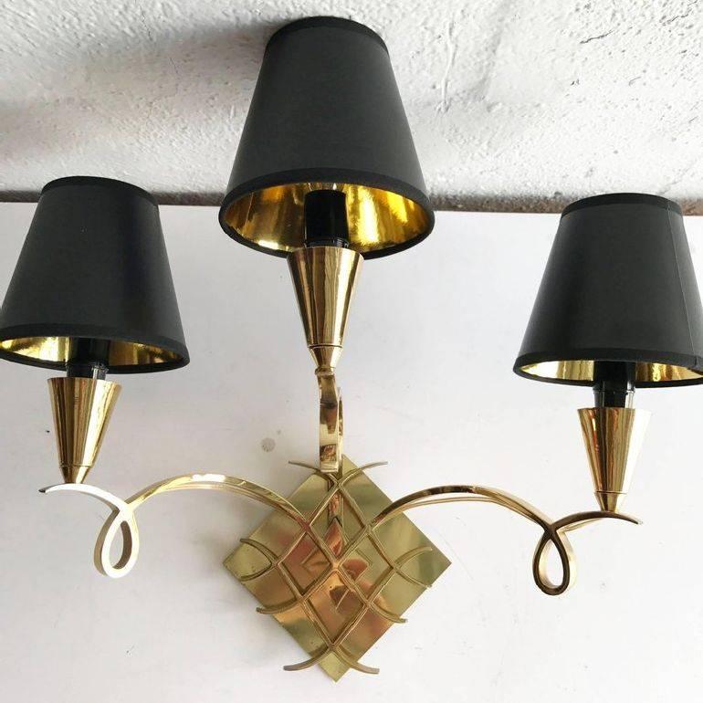 Superb pair of bronze sconces, 3 arms, 3 lights, 75 watts max bulb US rewired and in working condition backplate dimension 5 by 5 inches.
Have a look on our the largest collection of French and Italian Mid-Century period sconces, more than 200