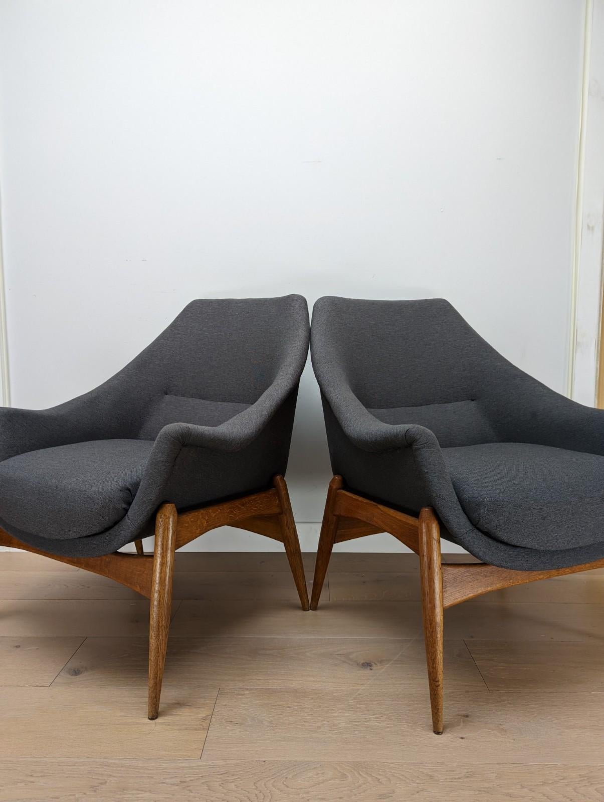 A rare pair of Julia Gaubek club chairs.

The chairs were imported from Hungary 3 years ago and they were reupholstered in a grey wool fabric. These are very much of the era with a simple but extremely stylish body sat on teak legs.

The condition