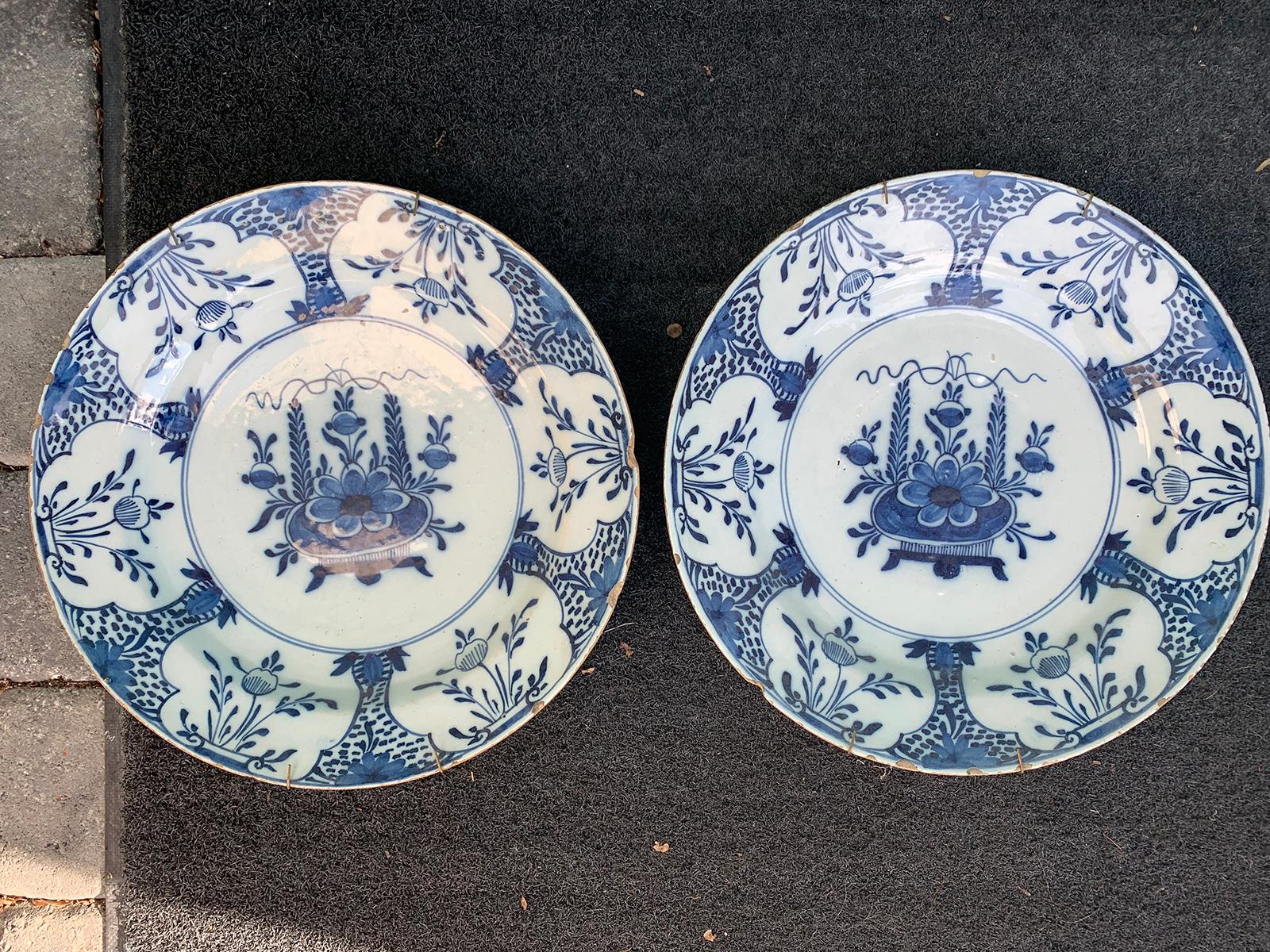 Pair of jumbo 18th century delft blue and white chargers.