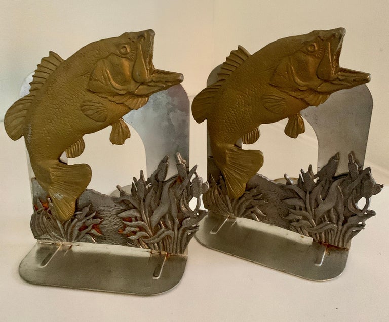 A wonderful pair of bookends with jumping fish. The pair would be a nice compliment to any office or den and especially those who are fishing enthusiasts (or Pisces). Made of metal with a lip at the bottom to hold more books.