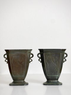 Pair of Just Andersen Art Nouveau vases in disco metal with figurative motifs.