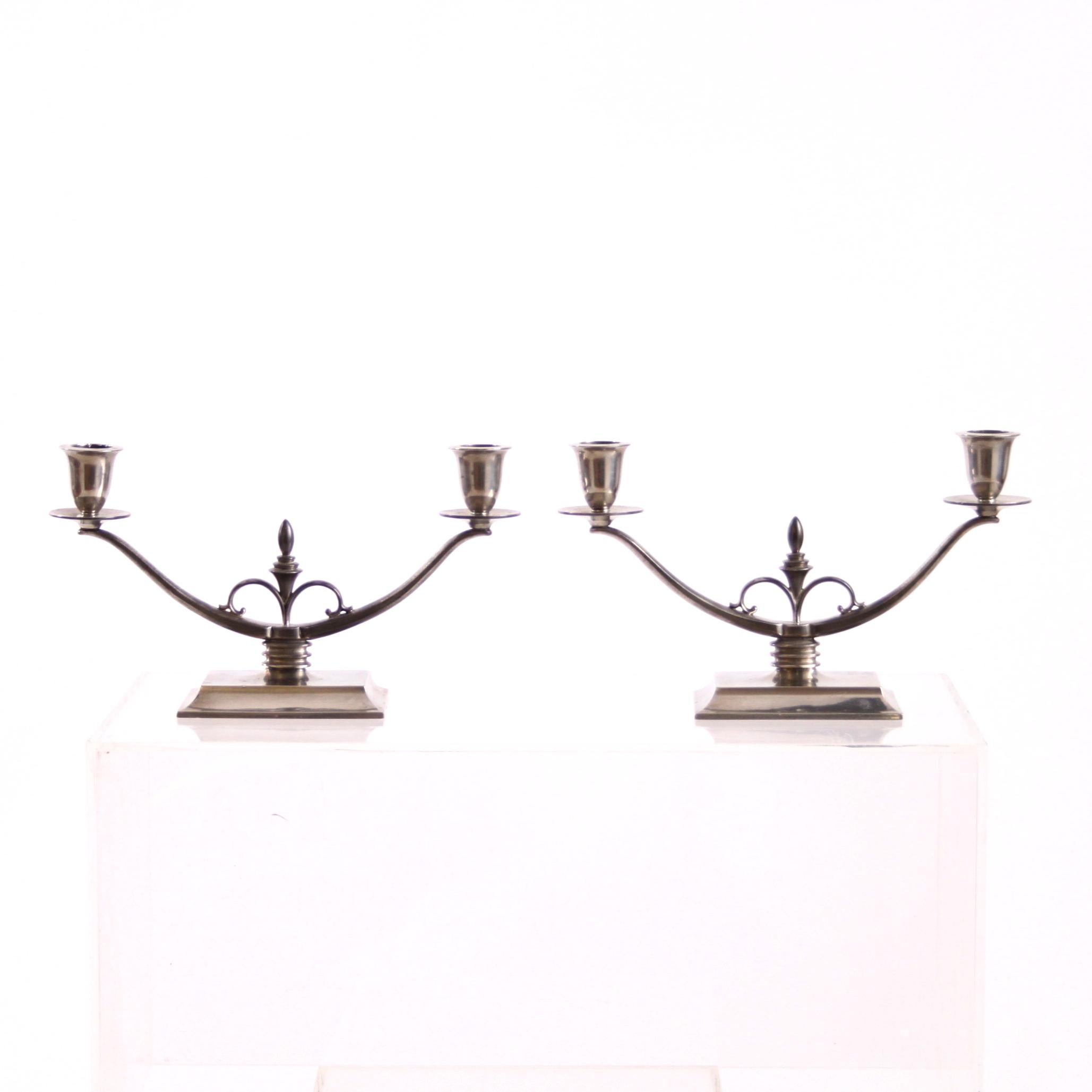 Just Andersen, Scandinavian Modern

A sculptural pair of Just Andersen candelabra model 1453, two-armed, rectangular footed, in matte pewter. 

Manufactured in Denmark 1933-35, stamped JUST 1453. 

Excellent vintage condition and a beautiful