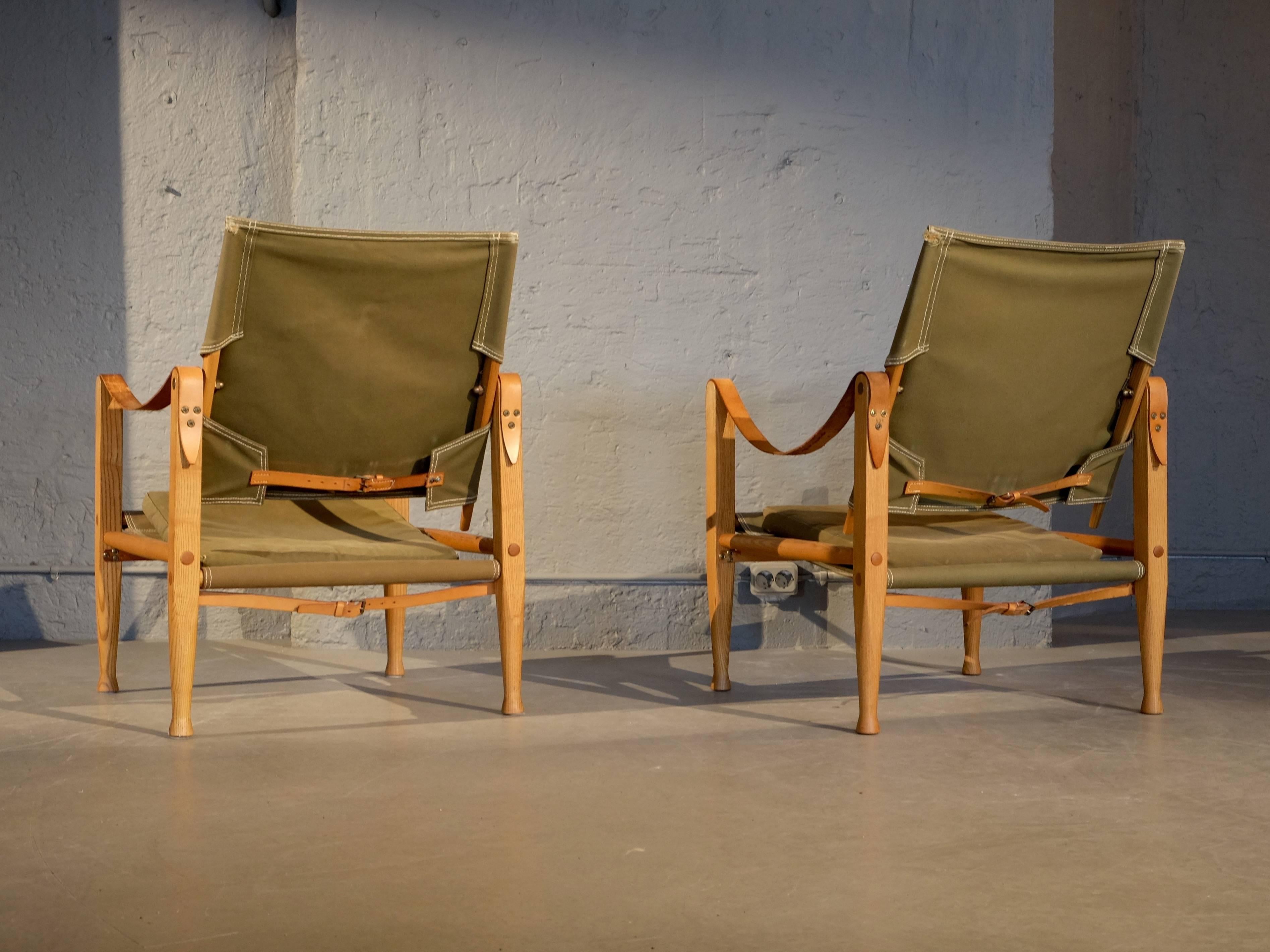 Military green Safari chairs with patinated cognac brown leather. Designed by Kaare Klint in 1933, produced by Rud. Rasmussen, Denmark, 1960s.