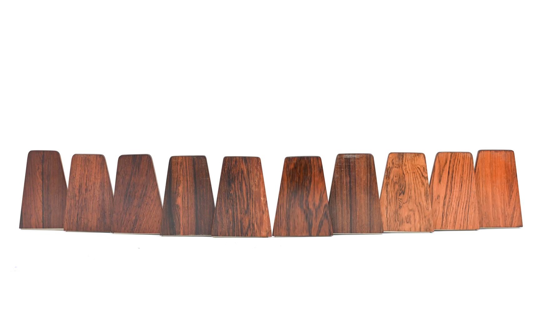 A pair of Danish midcentury rosewood bookends by the esteemed designer Kai Kristiansen. These bookends are a wonderful accessory to bring in a Scandinavian modern element. Multiple pairs available.