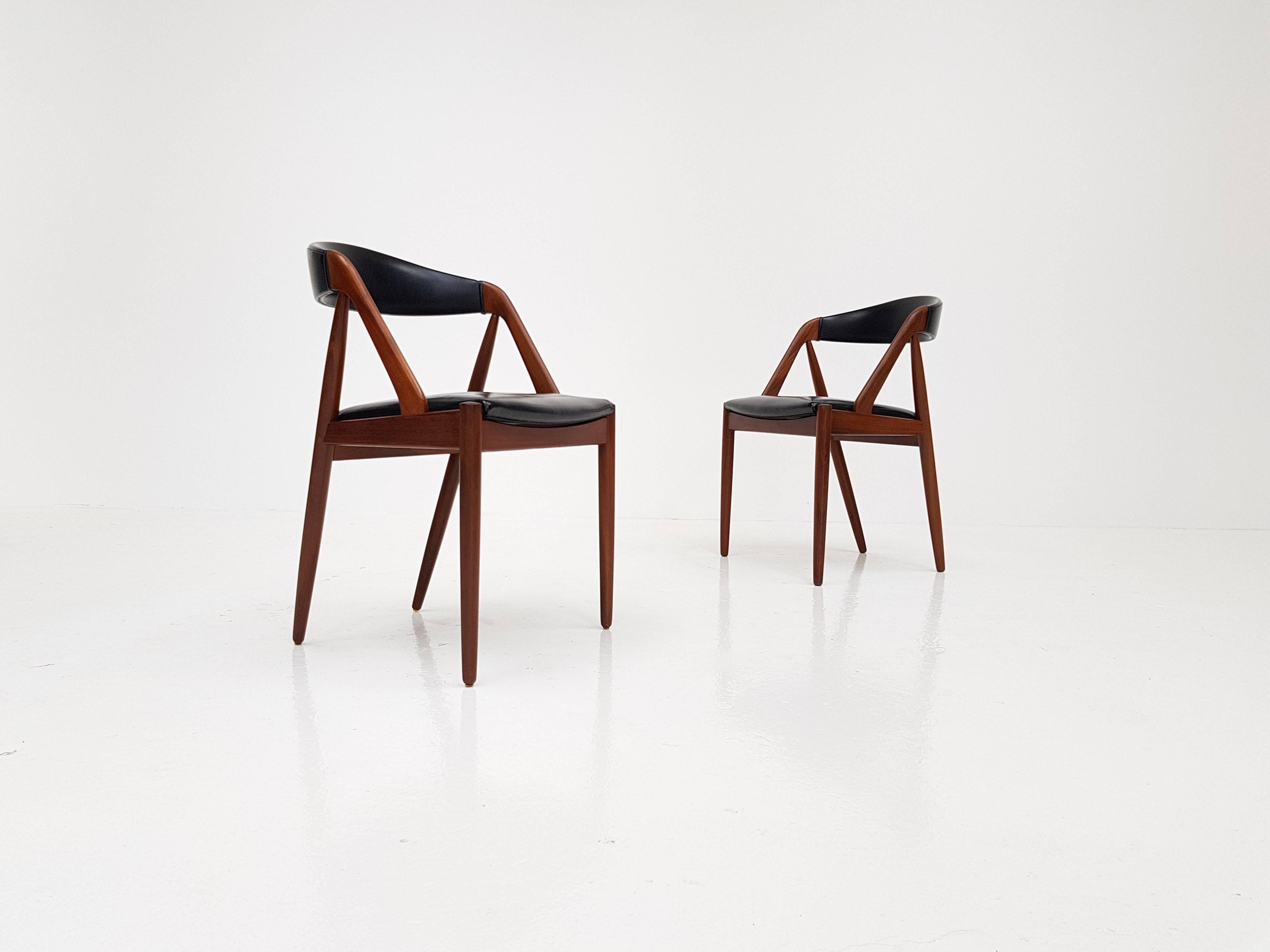 A pair of Kai Kristiansen model 31 teak 'A' frame dining chair for Schou Andersen, 1960s.

Amazing Kai Kristiansen model 31 teak 'A' frame dining chair for Schou Andersen, 1960s, original faux black leather upholstery.

 