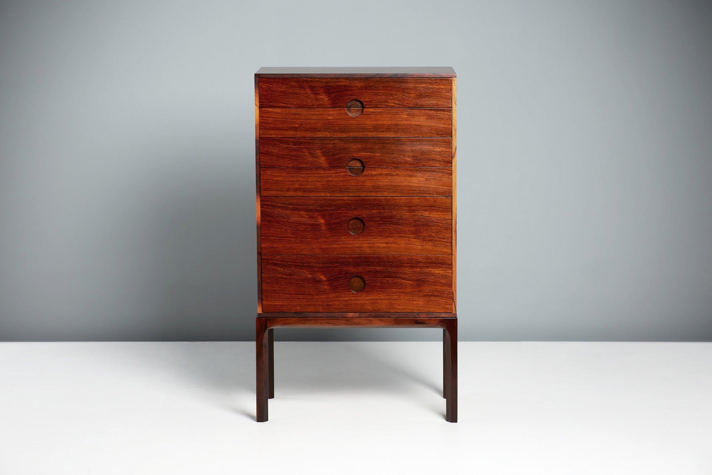 Kai Kristiansen - Pair of Model 385 Chest of Drawers, circa 1960

Rosewood tallboy chests, produced by Aksel Kjersgaard in Odder, Denmark. Solid rosewood frame with veneered cabinet and half-moon drawer pulls. Refinished in Danish oil. Rarely seen
