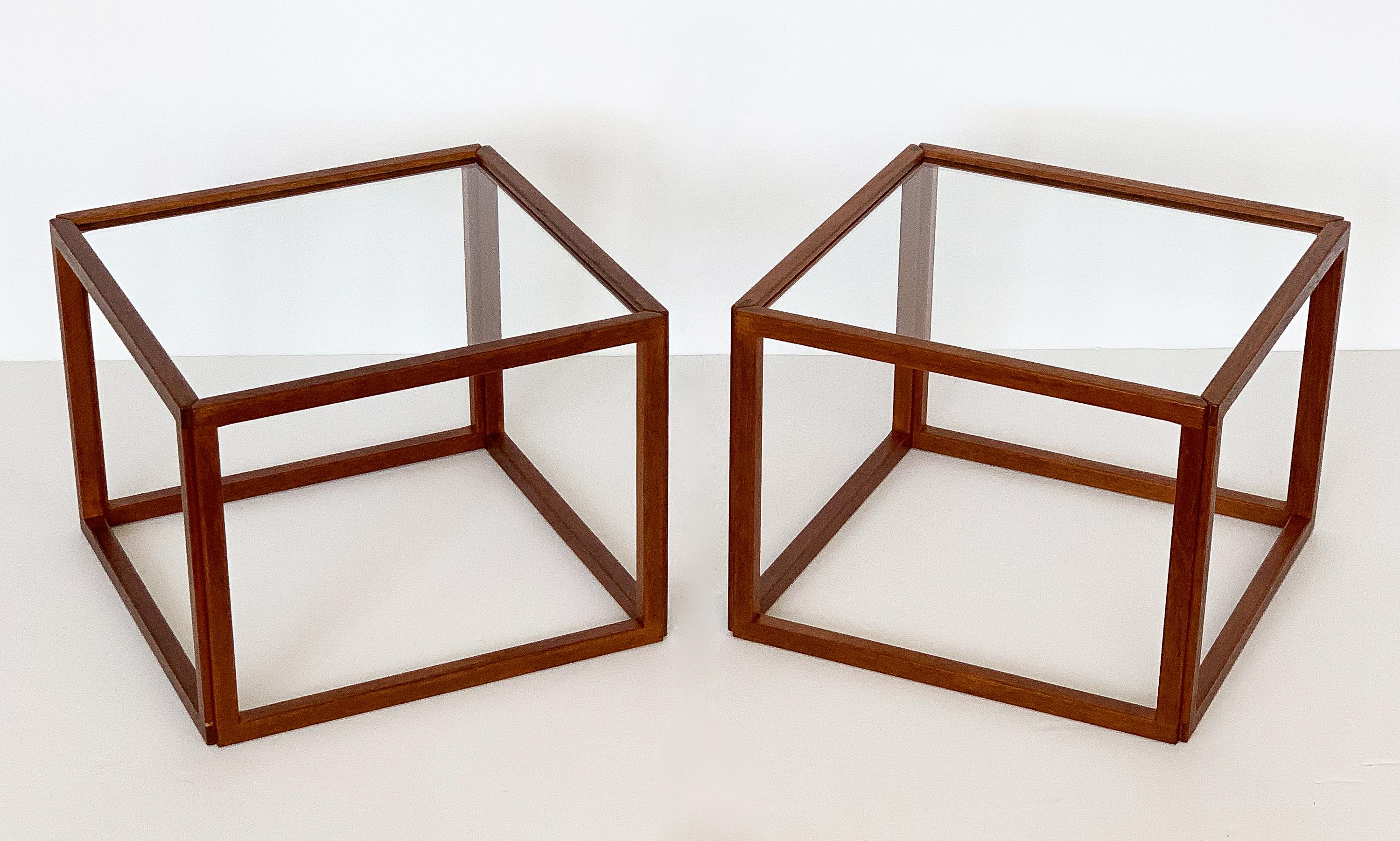 Pair of Kai Kristiansen teak cube side tables with fixed glass tops within the frames. Manufactured in Denmark, circa 1960s. Open cube framework in solid teak with glass top. Exposed tongue and grove joinery. Modern and architectural in form.