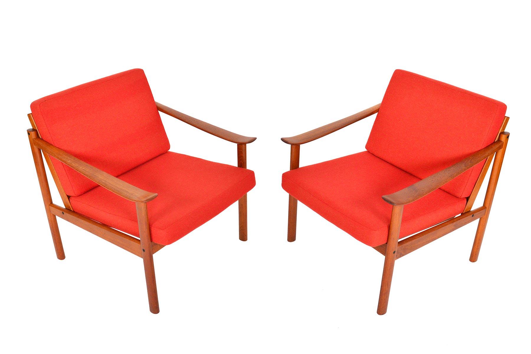 This beautifully sculpted pair of teak lounge chairs was designed by Kai Lyngfeldt Larsen for Søborg Møbelfabrik in the 1960s. Expertly crafted, this pair will make the perfect addition to any modern home. Cascading arm forms offer an exceptional