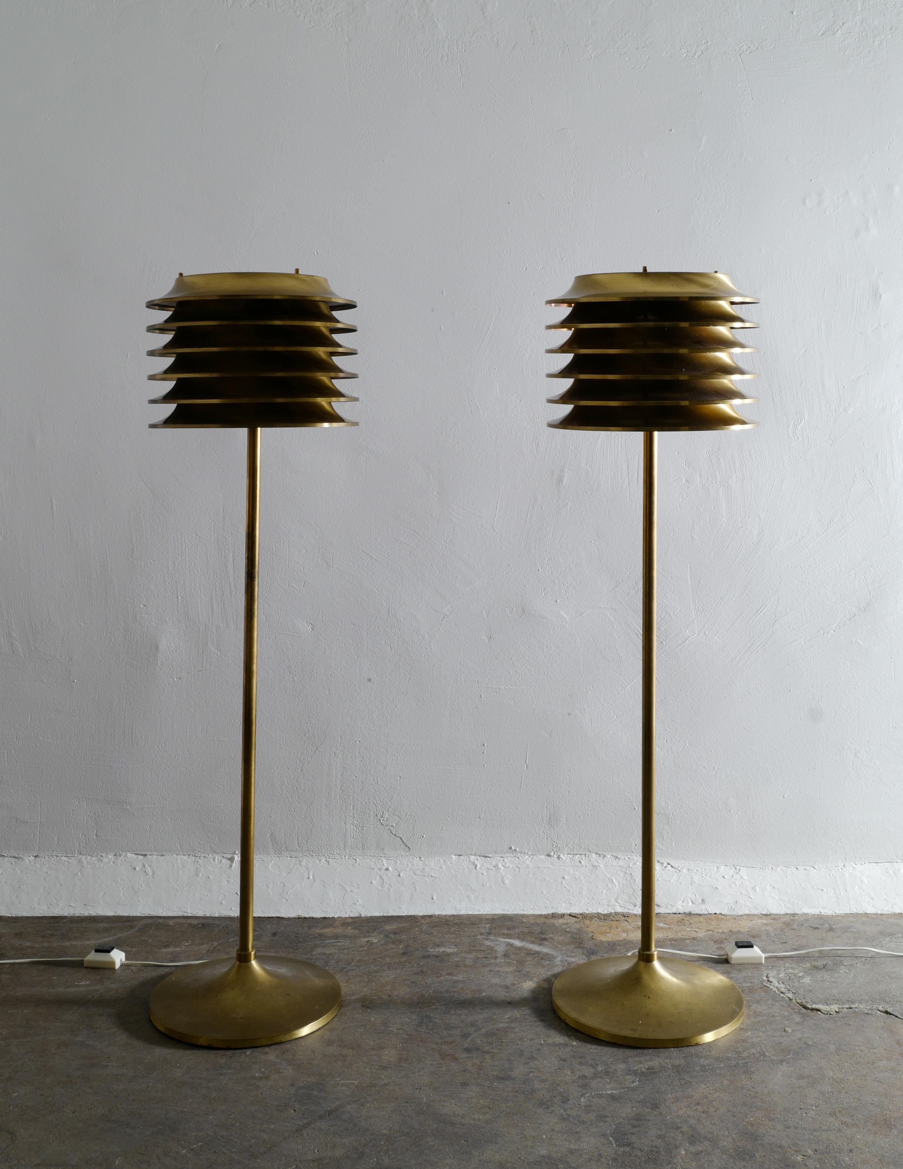Very rare pair of floor lamps in brass designed by Kai Ruokonen in 1970s and produced by Orno Oy, Finland. The pair is in great and original condition with some signs of use and patina. Both are signed and working.