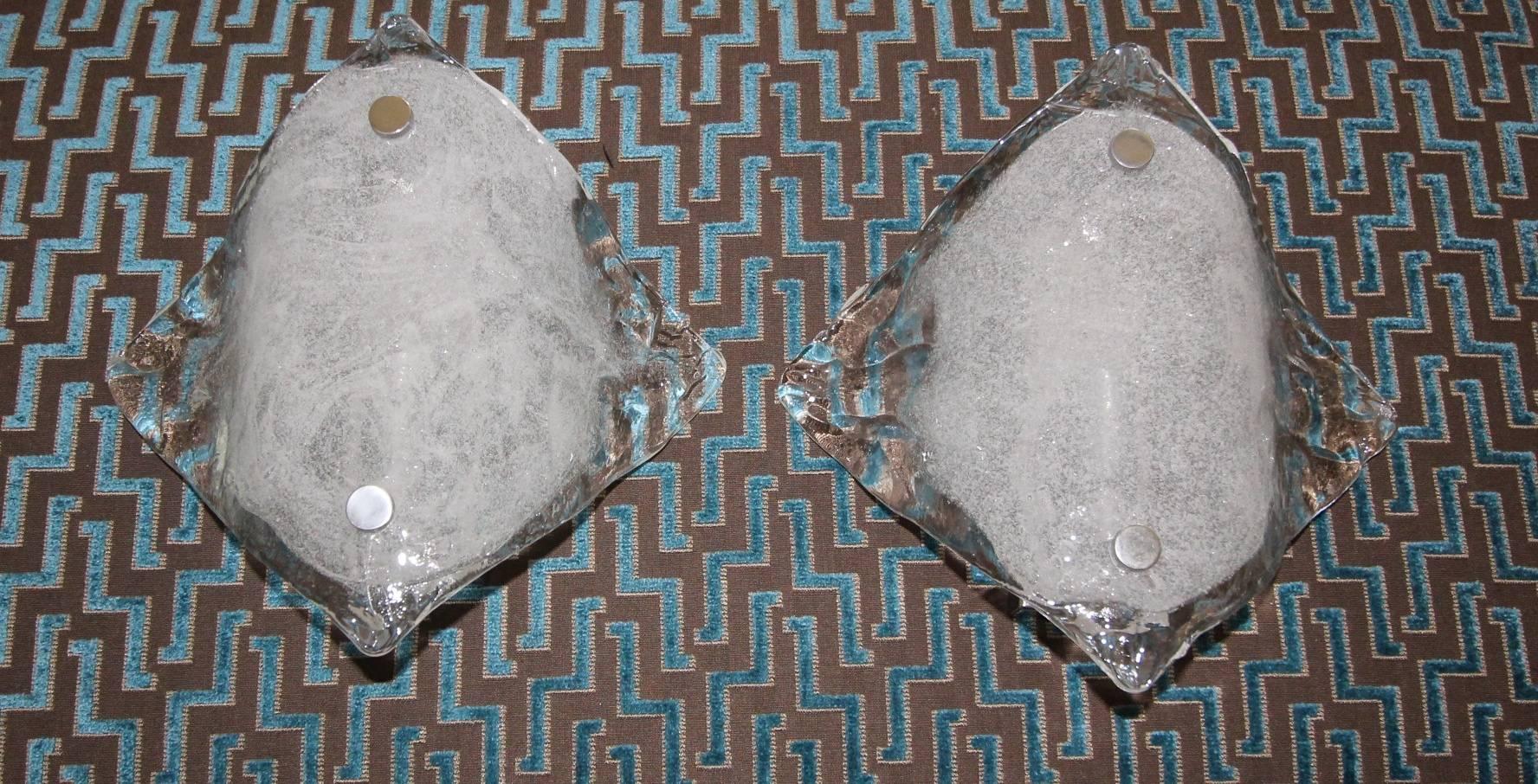 Pair of clear and opaque glass sconces by J. T. Kalmar, mounted on nickel backplates and fittings. Takes one 40 watt candelabra size bulb, newly wired.
Glass size: 9.5