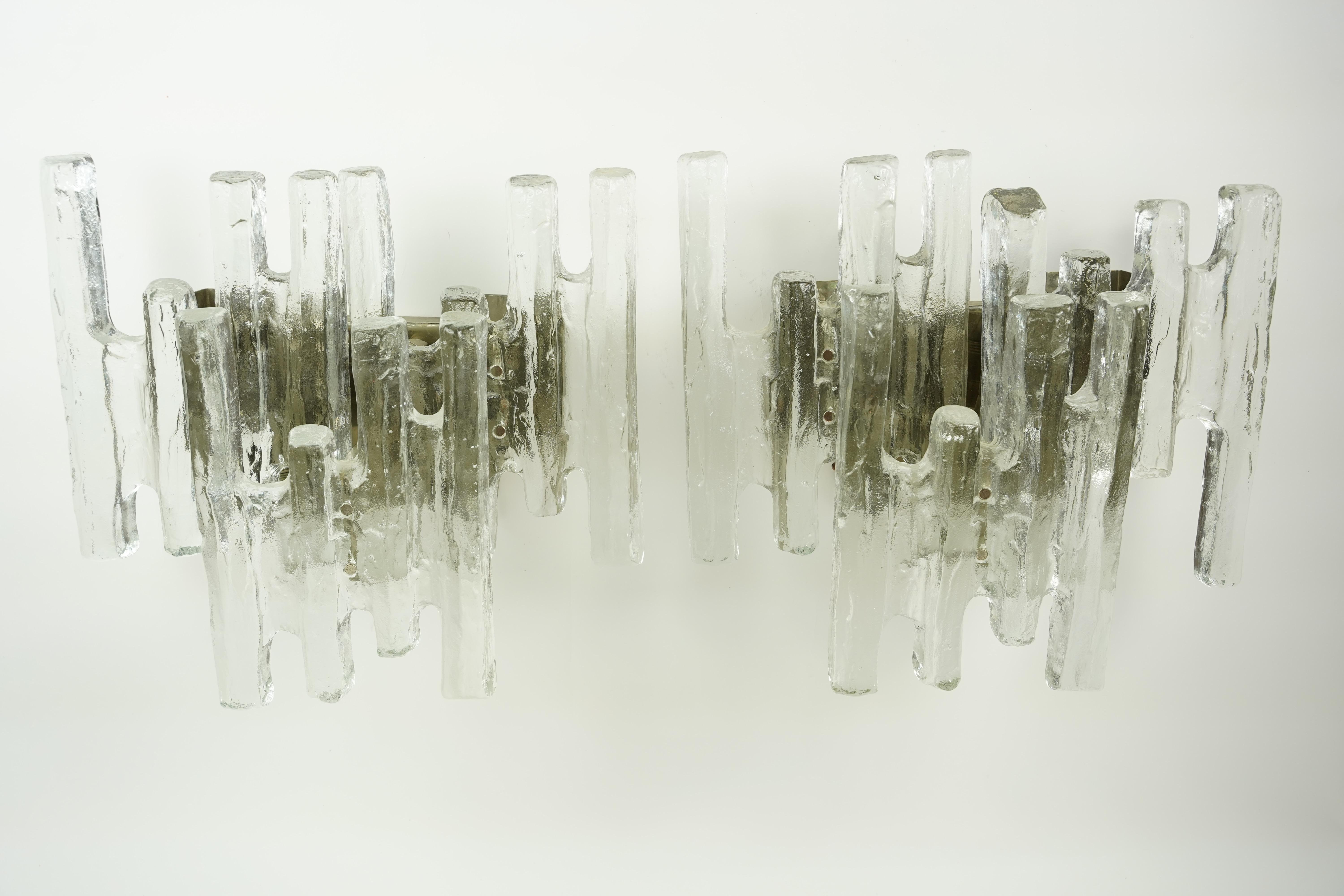 Pair of Kalmar glass sconces 1970s Vienna Austria,  Chrome frame with chrome finials holding Three individual pieces of clear glass .
Rewired for the US.
Four candelabra light sockets.