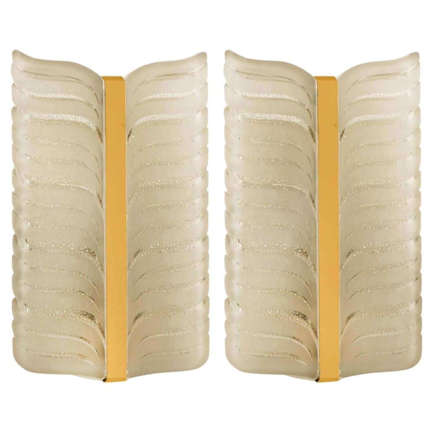 Pair of  of Kalmar leaf sconces. Brass center with two panels of glass surrounding both sides.
Thick glass with opaque lines in leaf pattern.

Minimalistic design executed with a taste for excellence in craftsmanship. Good cleaned respecting the