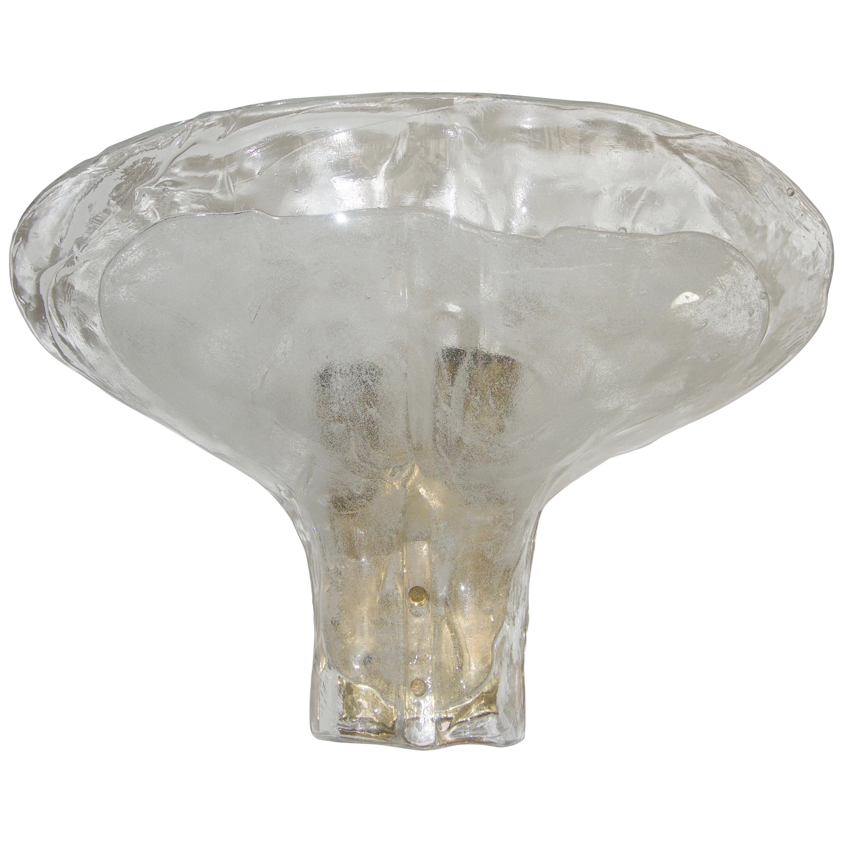 This stylish and chic pair of Kalmar glass wall sconces were acquired from a Palm Beach estate and will make a definite statement in your home.

The Murano glass shades are could be interpreted as flower petals or perhaps an upturned whale's